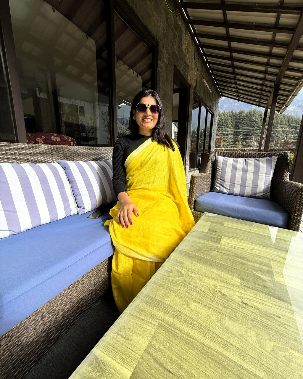 Front view of bright yellow pure linen saree with zari border showcasing full drape and elegant finish