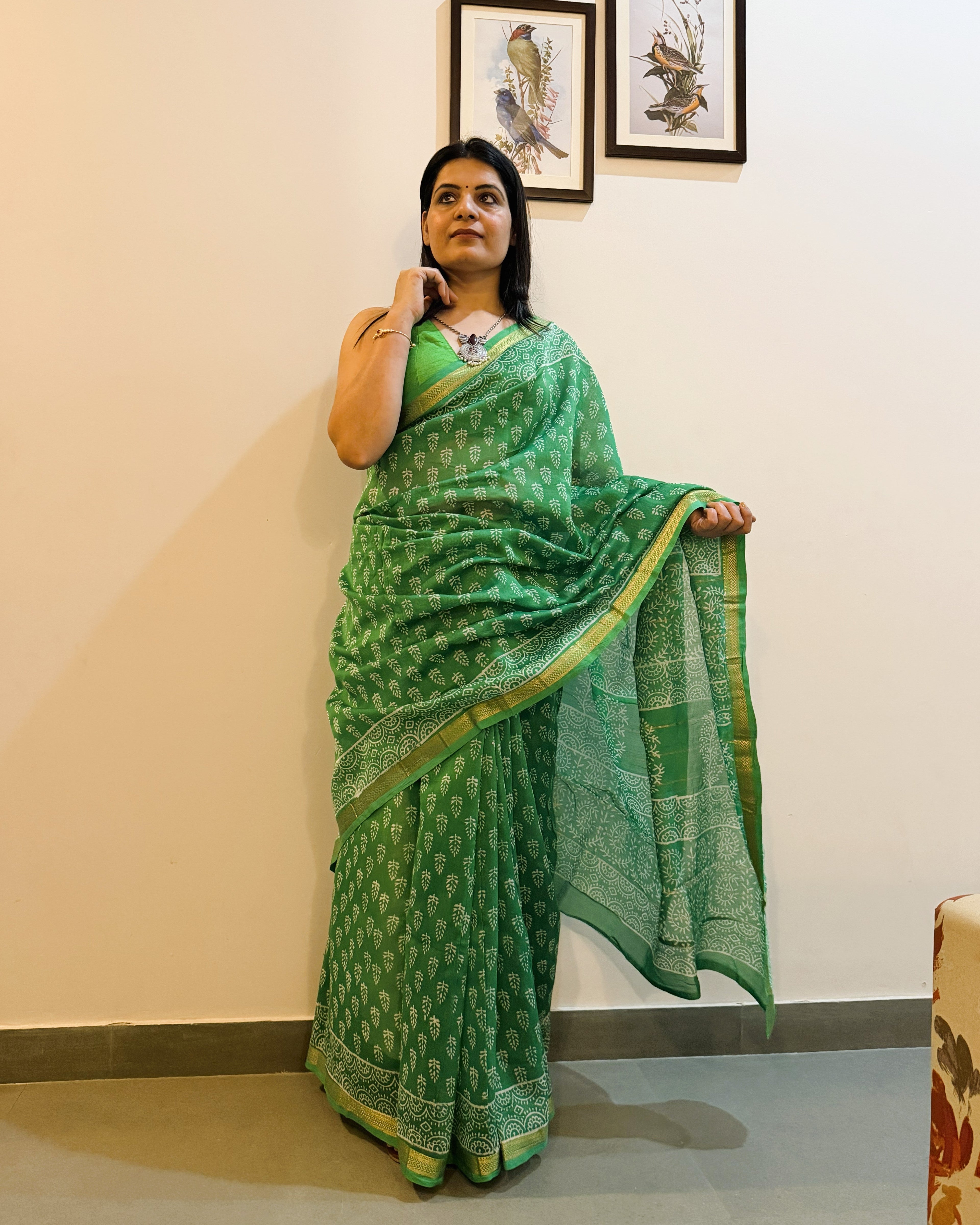 Model wearing green leaf print Maheshwari silk saree styled look