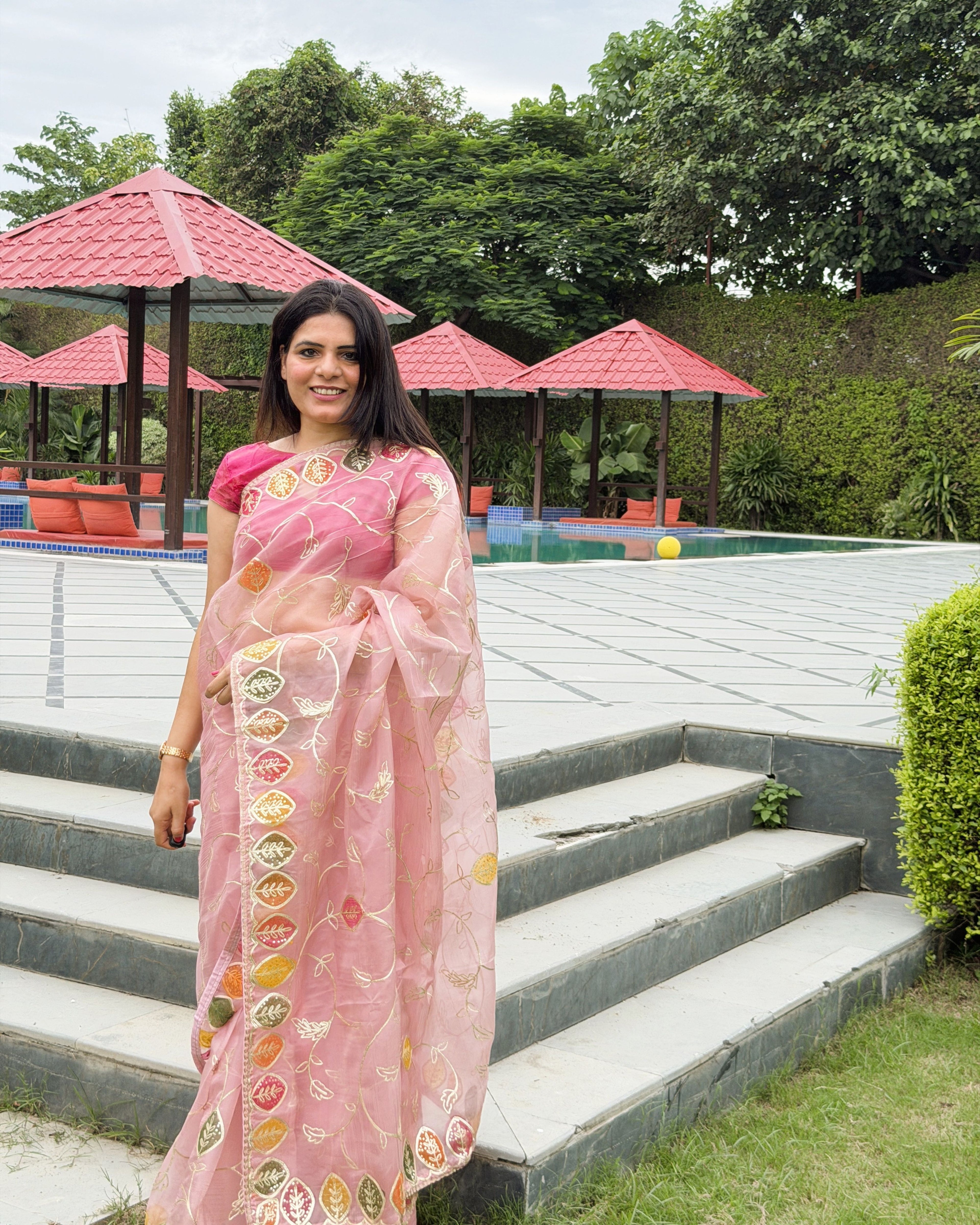 delicate metallic gotta patti border detail on peach organza saree