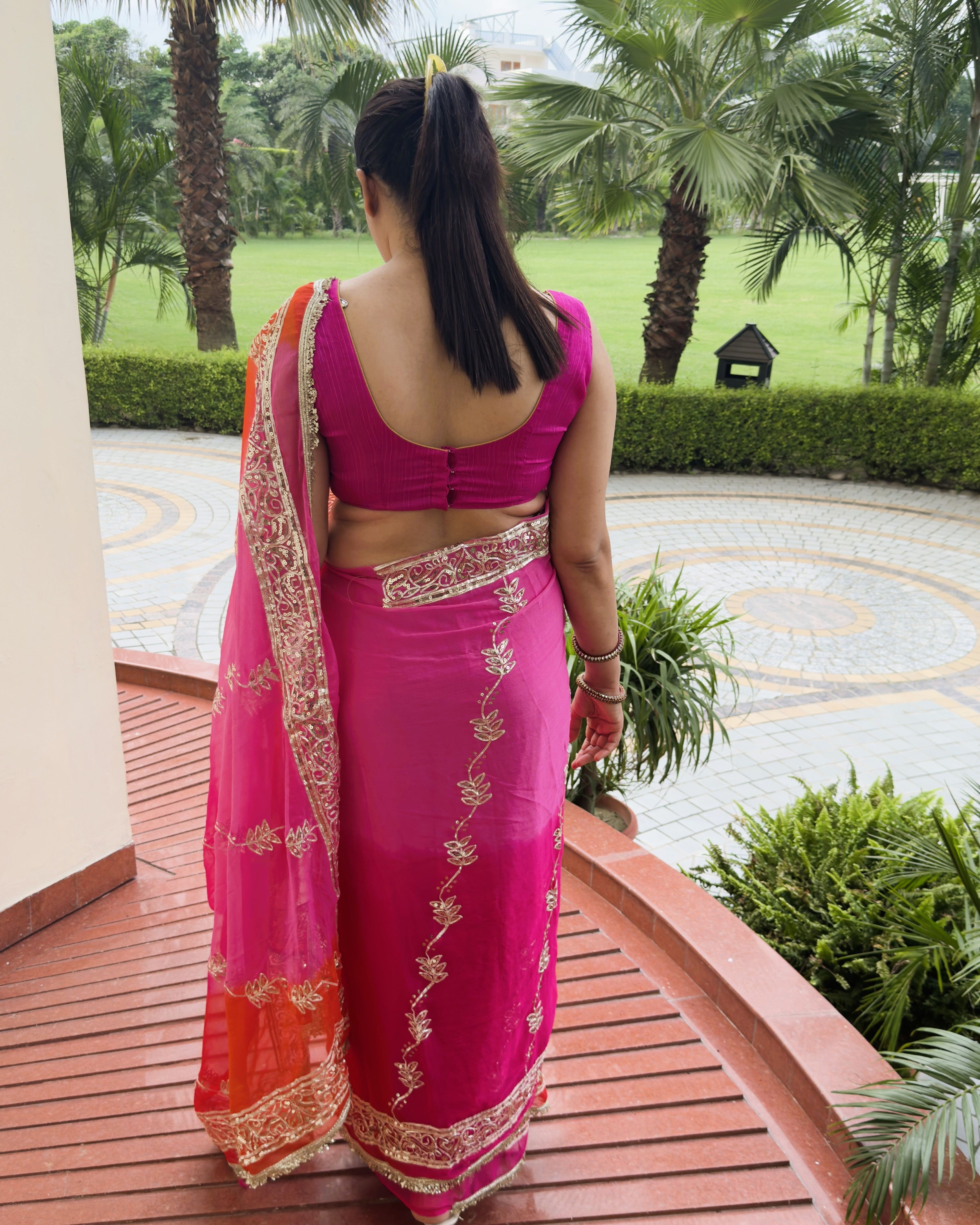 hot pink chiffon saree back view with silver gotta patti embellishment