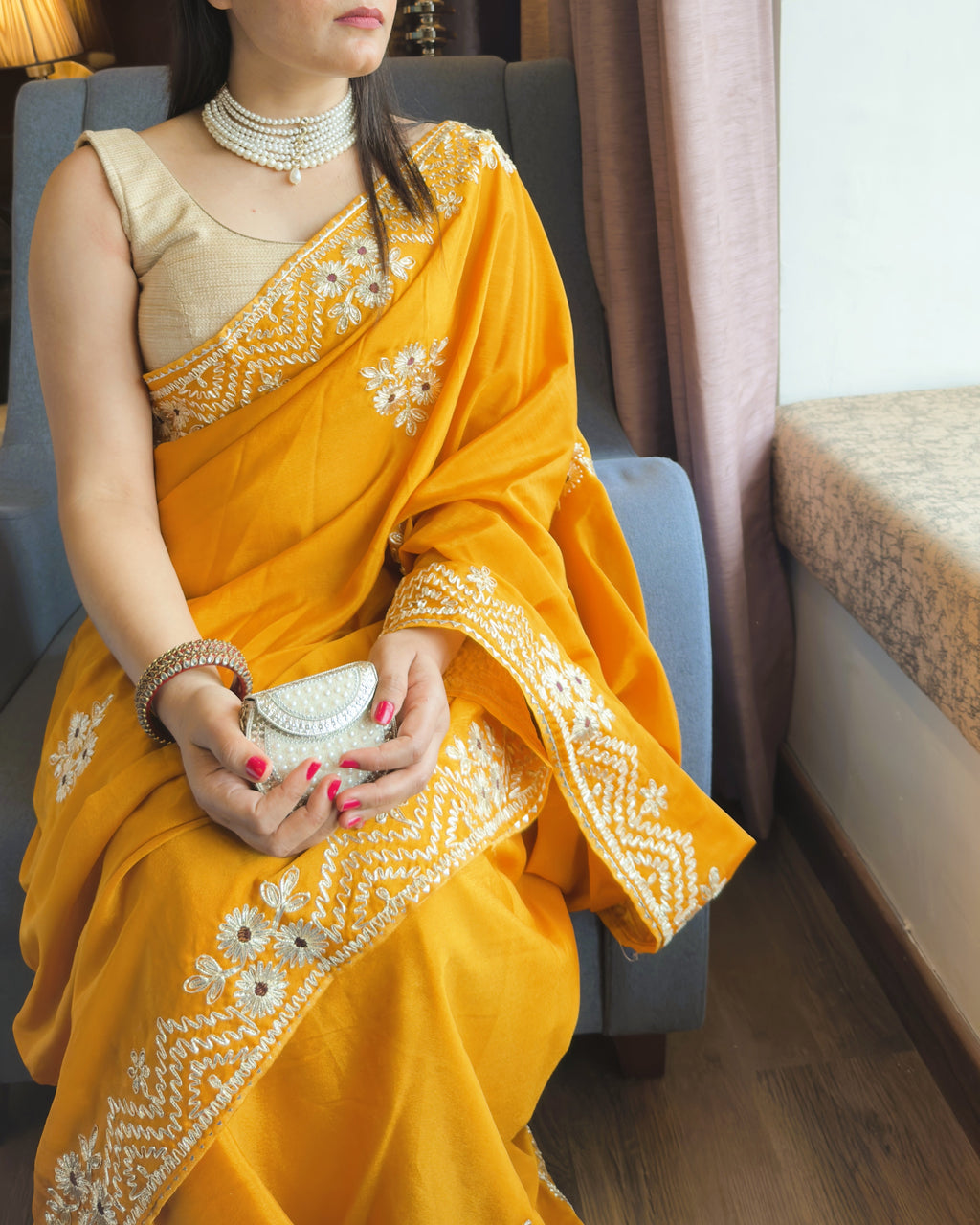 below neck view of mustard yellow vichitra silk saree with silver floral gotta patti work