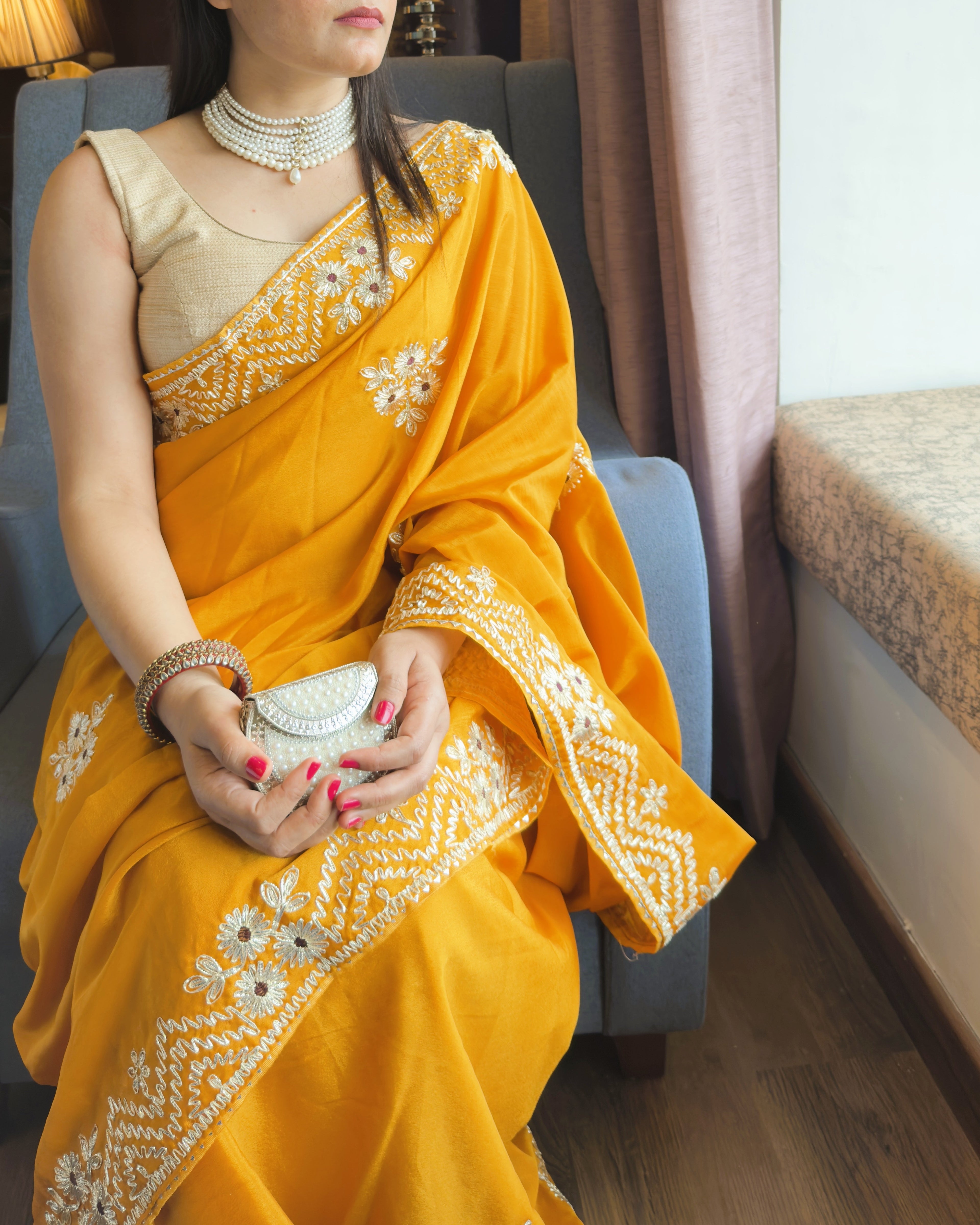 below neck view of mustard yellow vichitra silk saree with silver floral gotta patti work