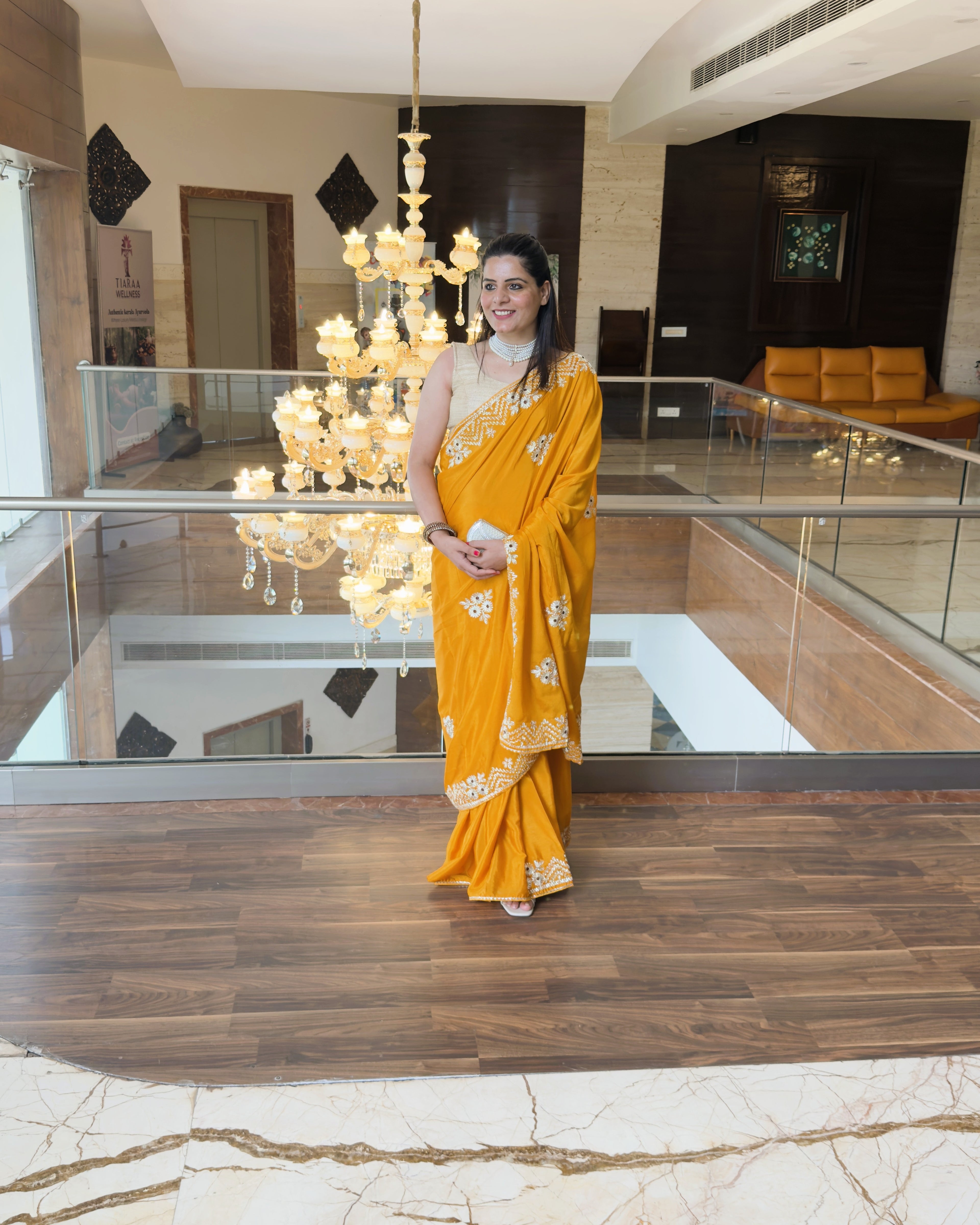 full look of mustard yellow vichitra silk saree with silver gotta patti floral motifs