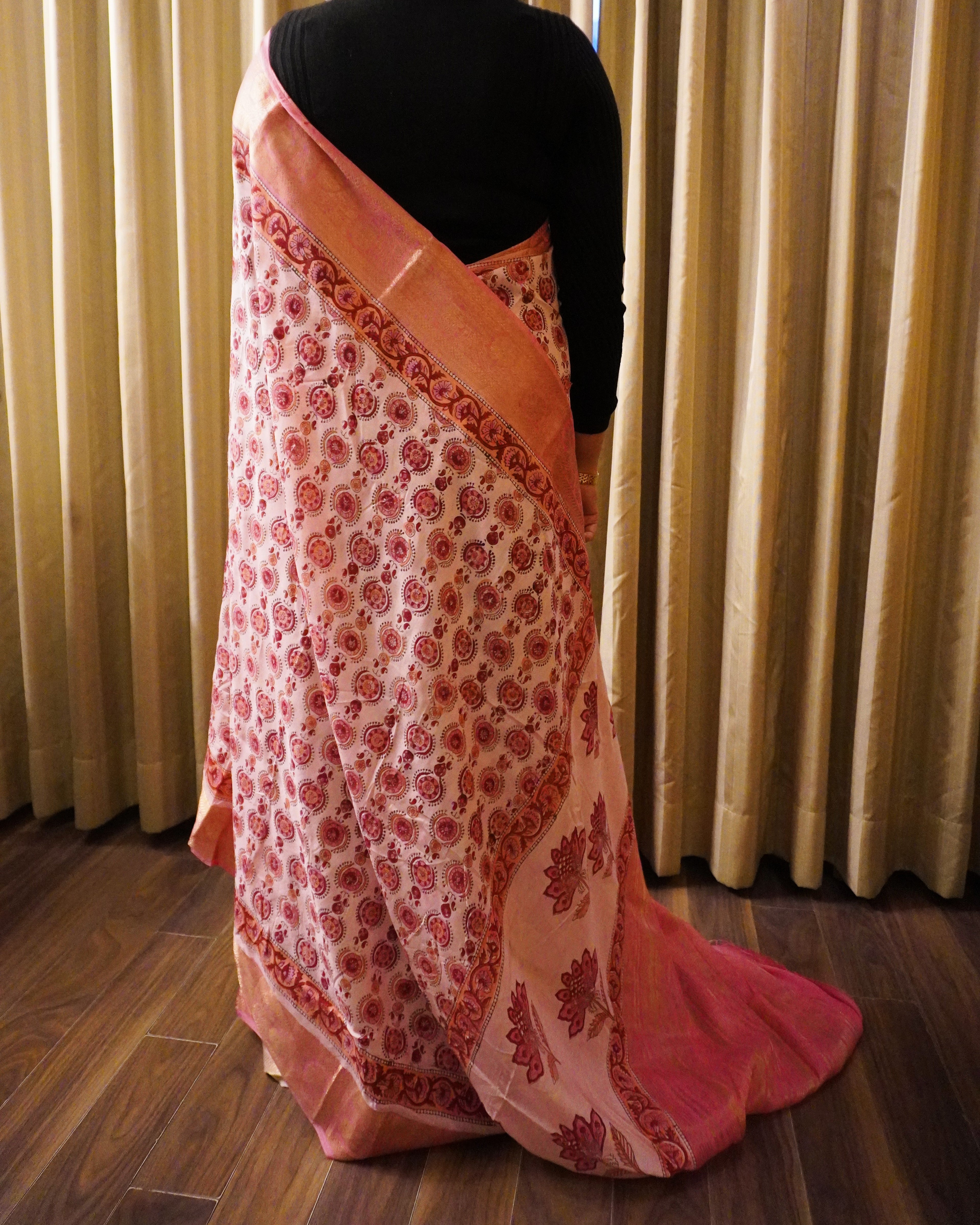 Back view of pink Bagru print modal silk saree highlighting pallu design and elegant fall