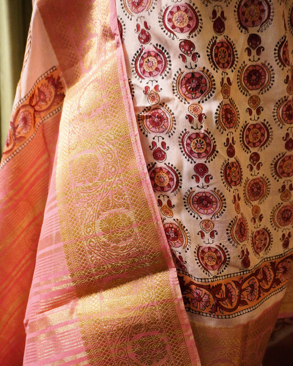 Close-up of pink Bagru print modal silk saree showing intricate handblock patterns and soft fabric texture
