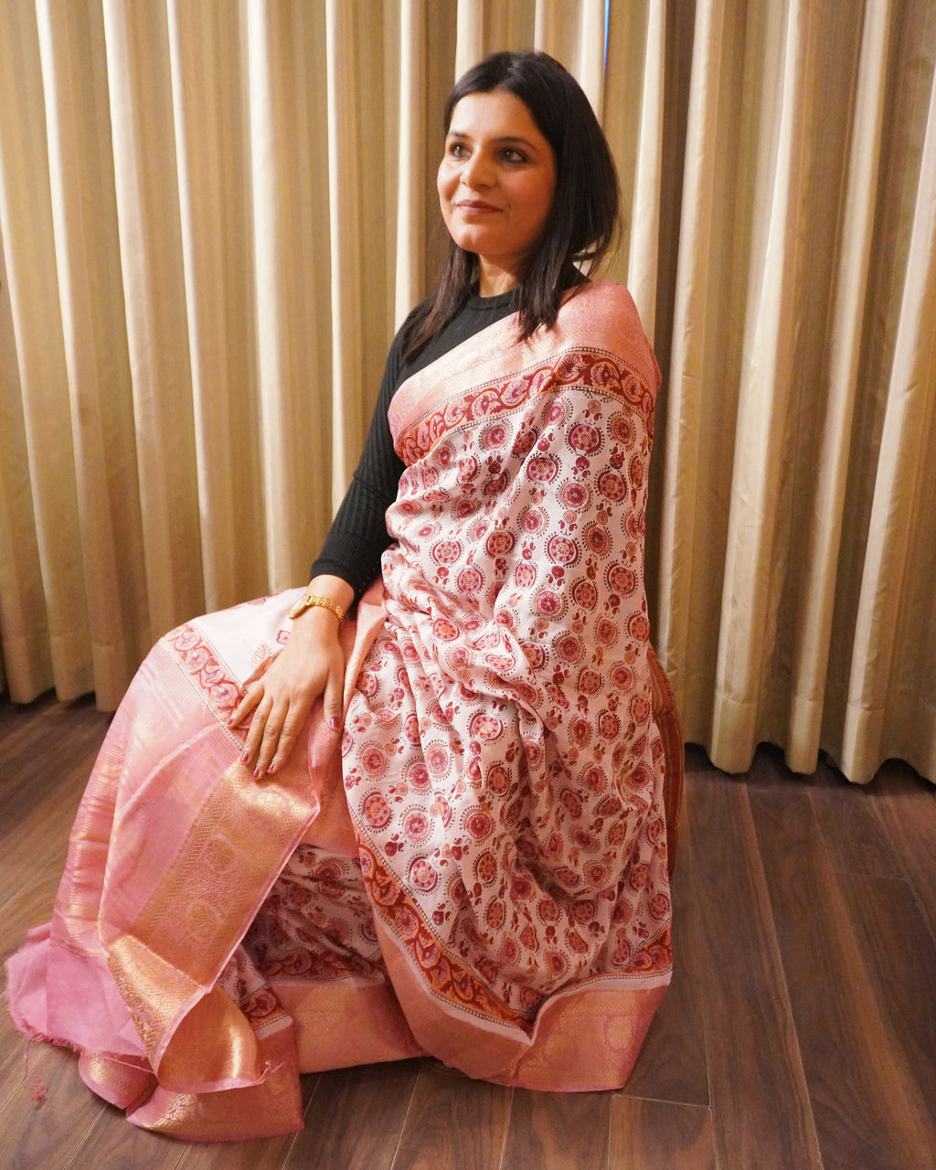 Side view of pink Bagru print modal silk saree displaying graceful drape flow and border detailing