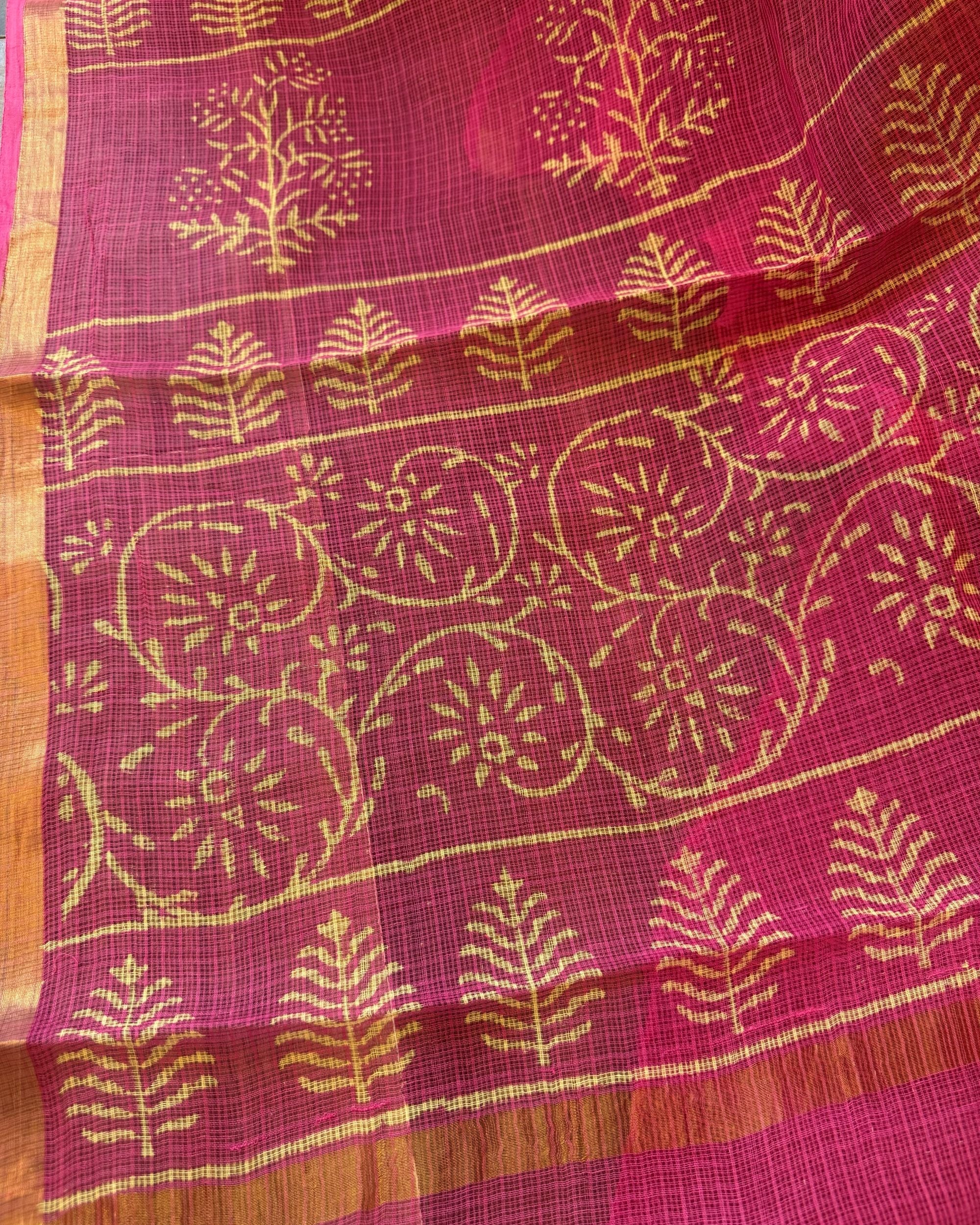 Fabric detail of pink and beige leaf motif handblock print Kota Doriya saree showcasing traditional handblock design