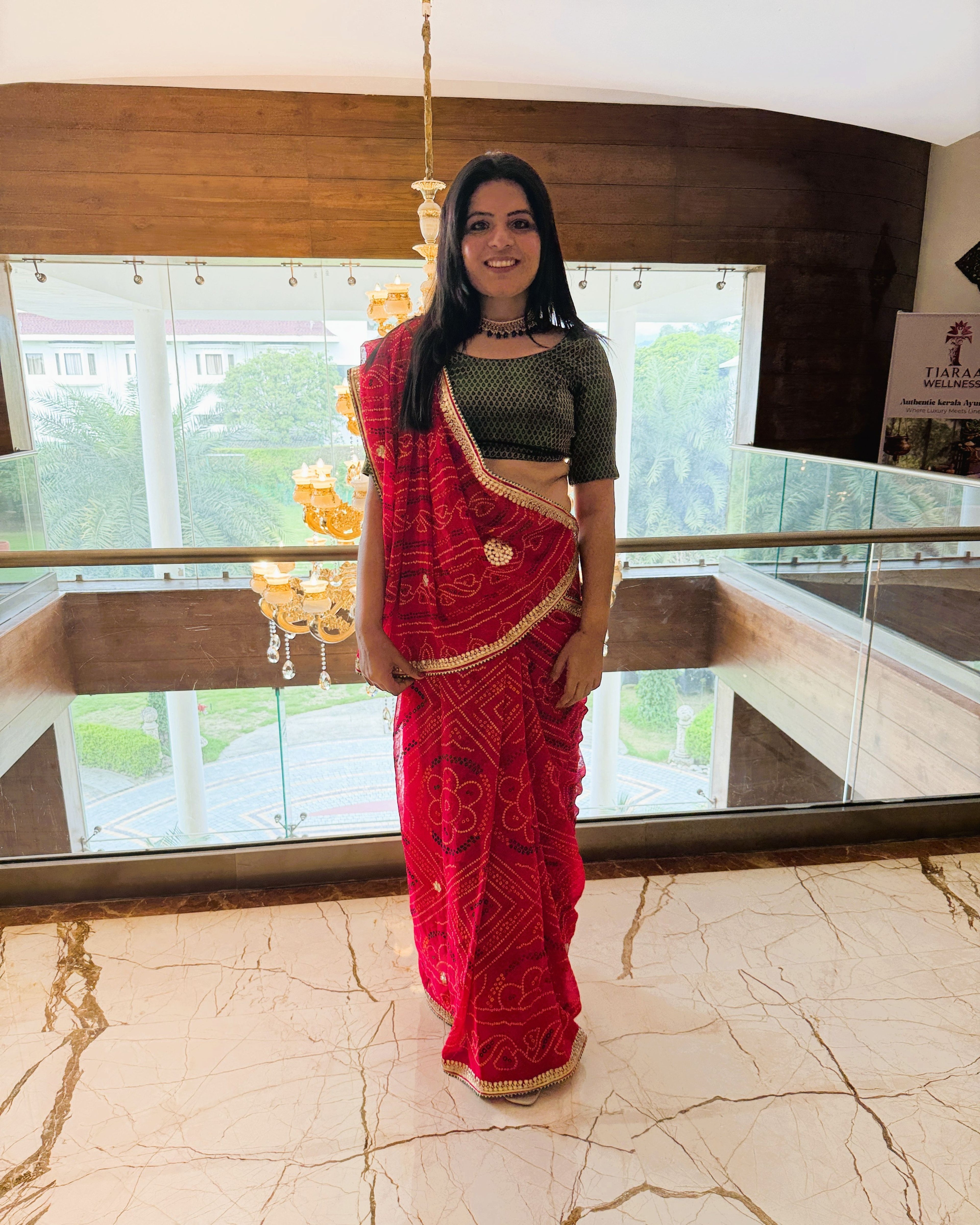 full view of rani pink pure georgette bandhej saree with detailed gotta patti border