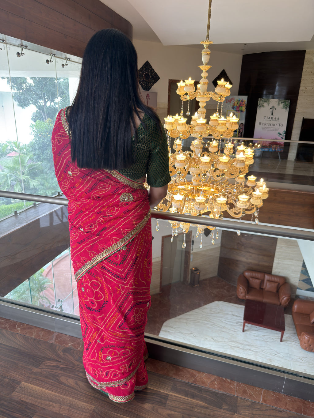 rani pink pure georgette bandhej print saree with gotta patti border back view