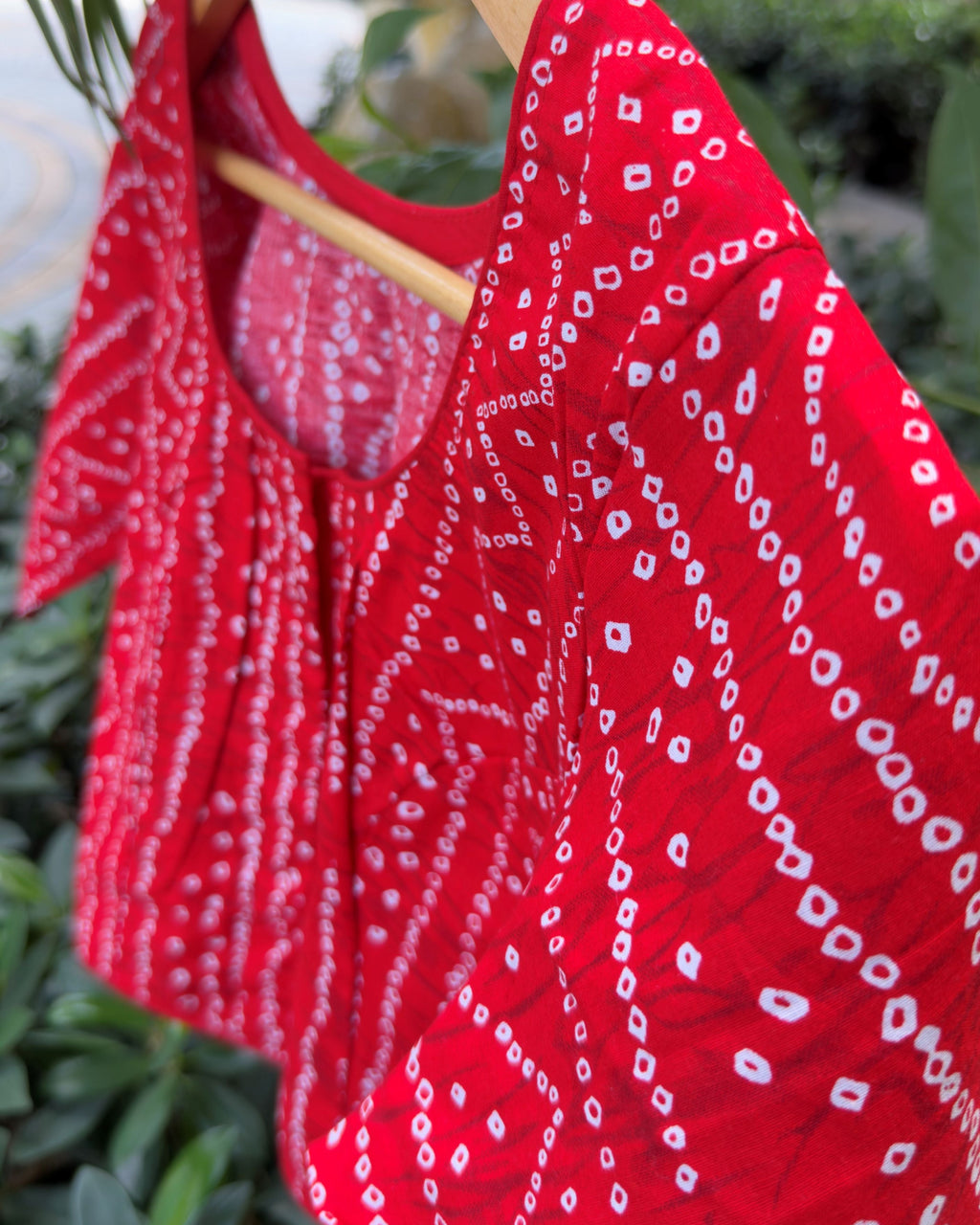 red cotton bandhej blouse with short sleeves and white dotted pattern