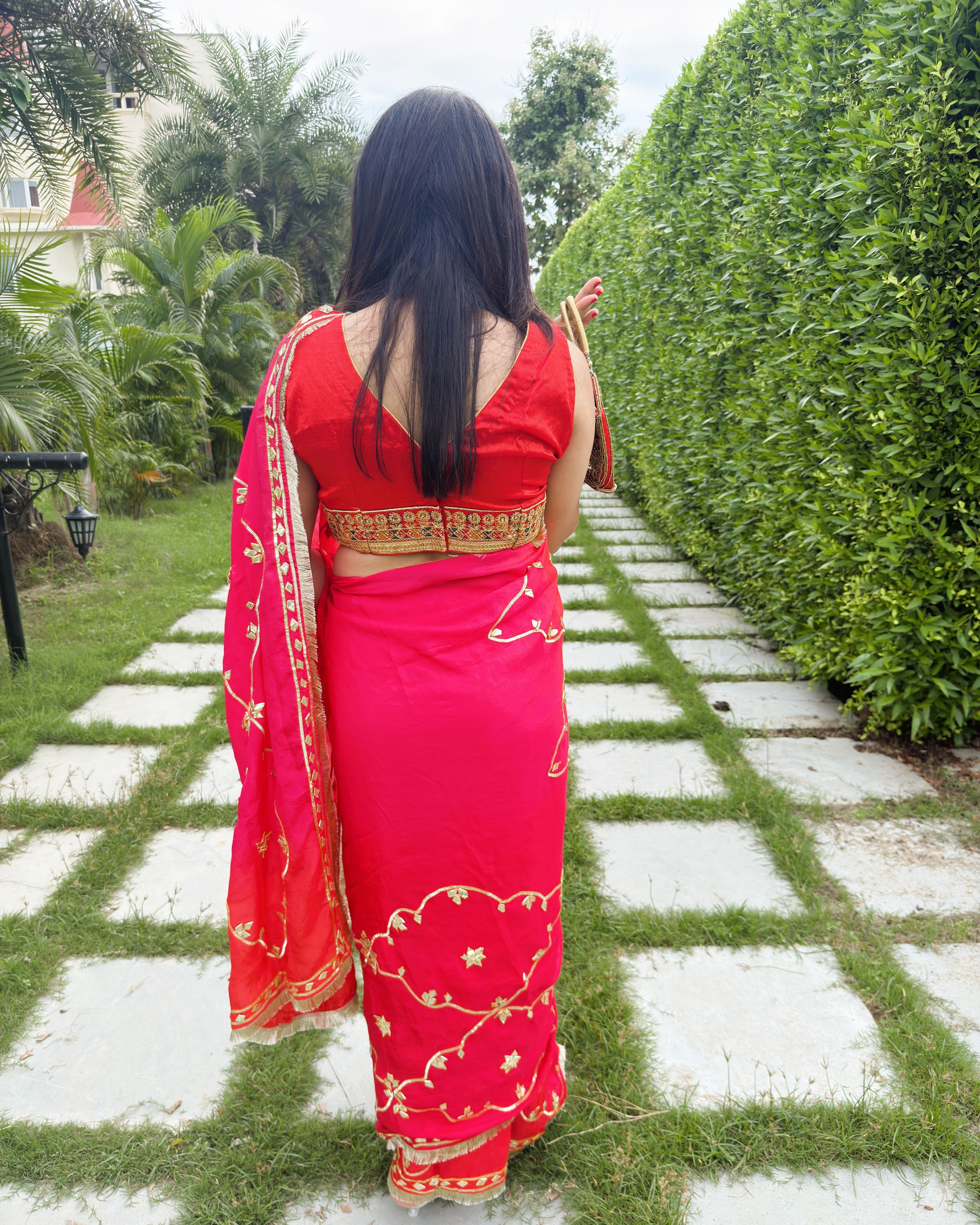rich red HO fabric featuring traditional gold gotta patti embellishment