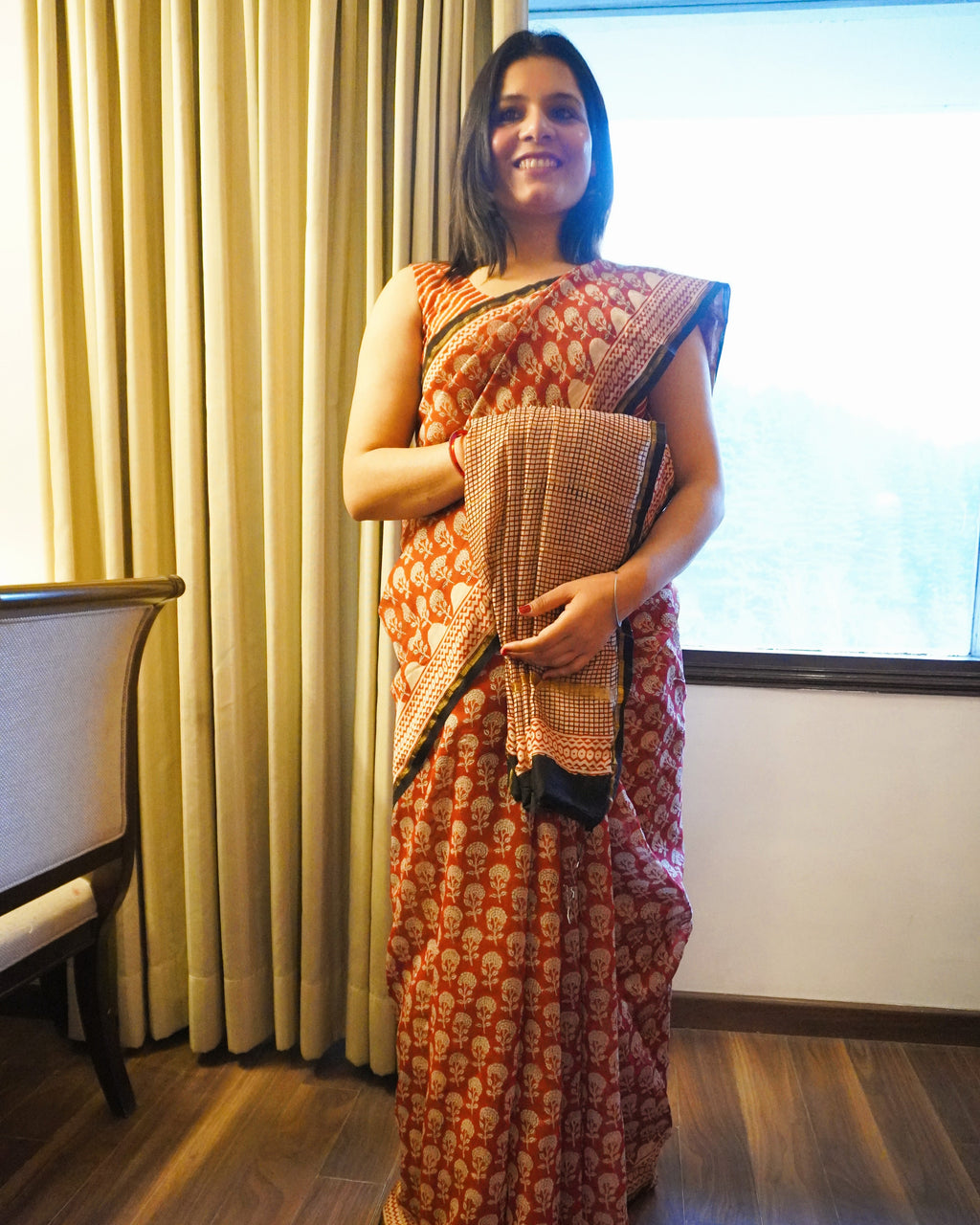 Front of rustic maroon Chanderi silk handblock Bagru print saree showcasing rich color and elegant drape