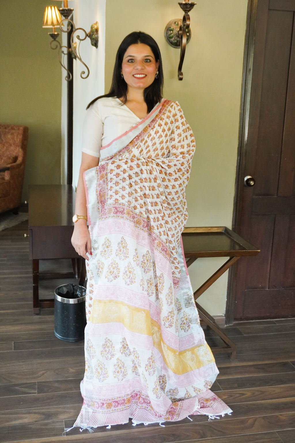 Full view of white multicolour handblock leaf motif print pure linen saree showcasing pallu design and elegant fall