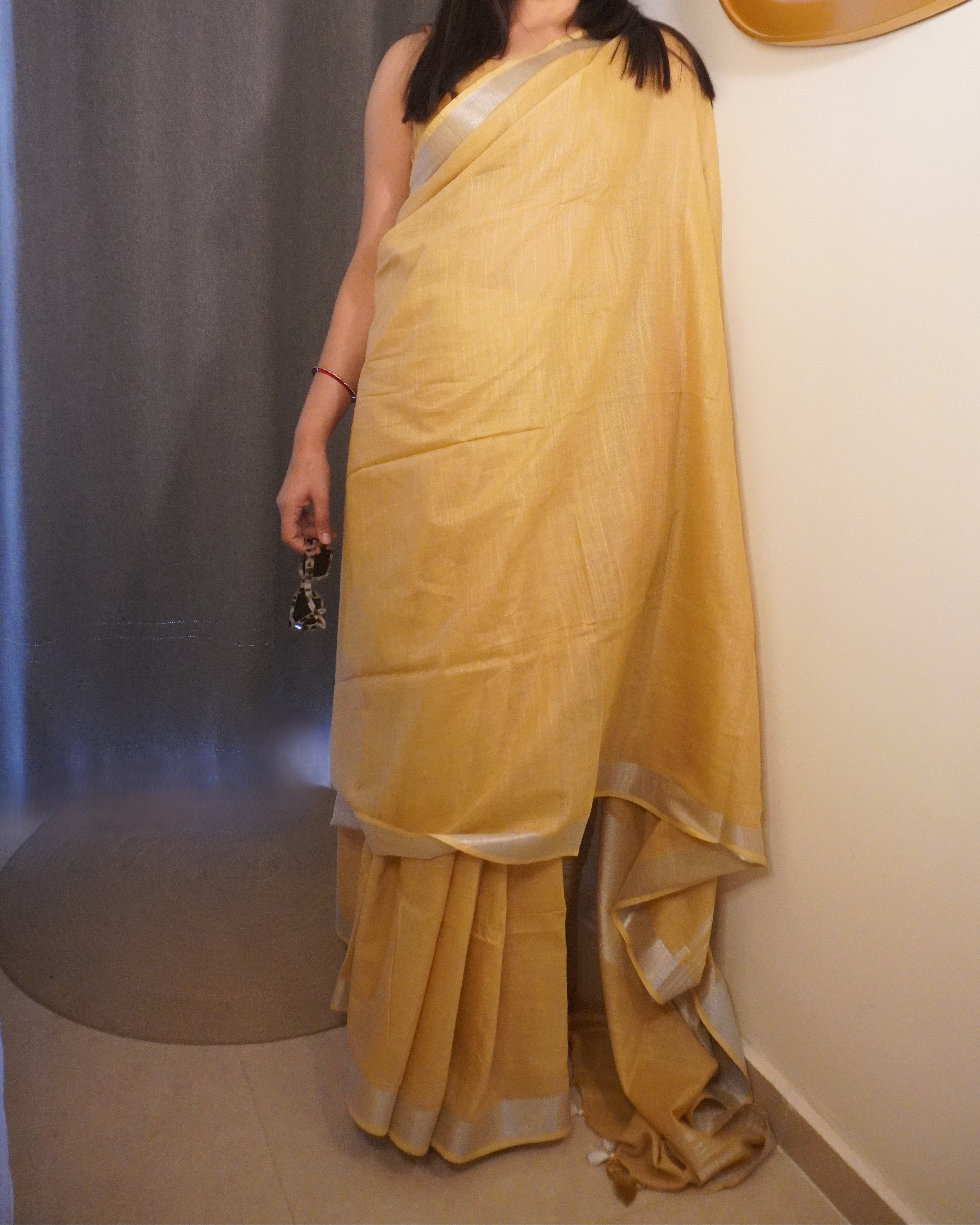 close up zari border beige pure linen saree