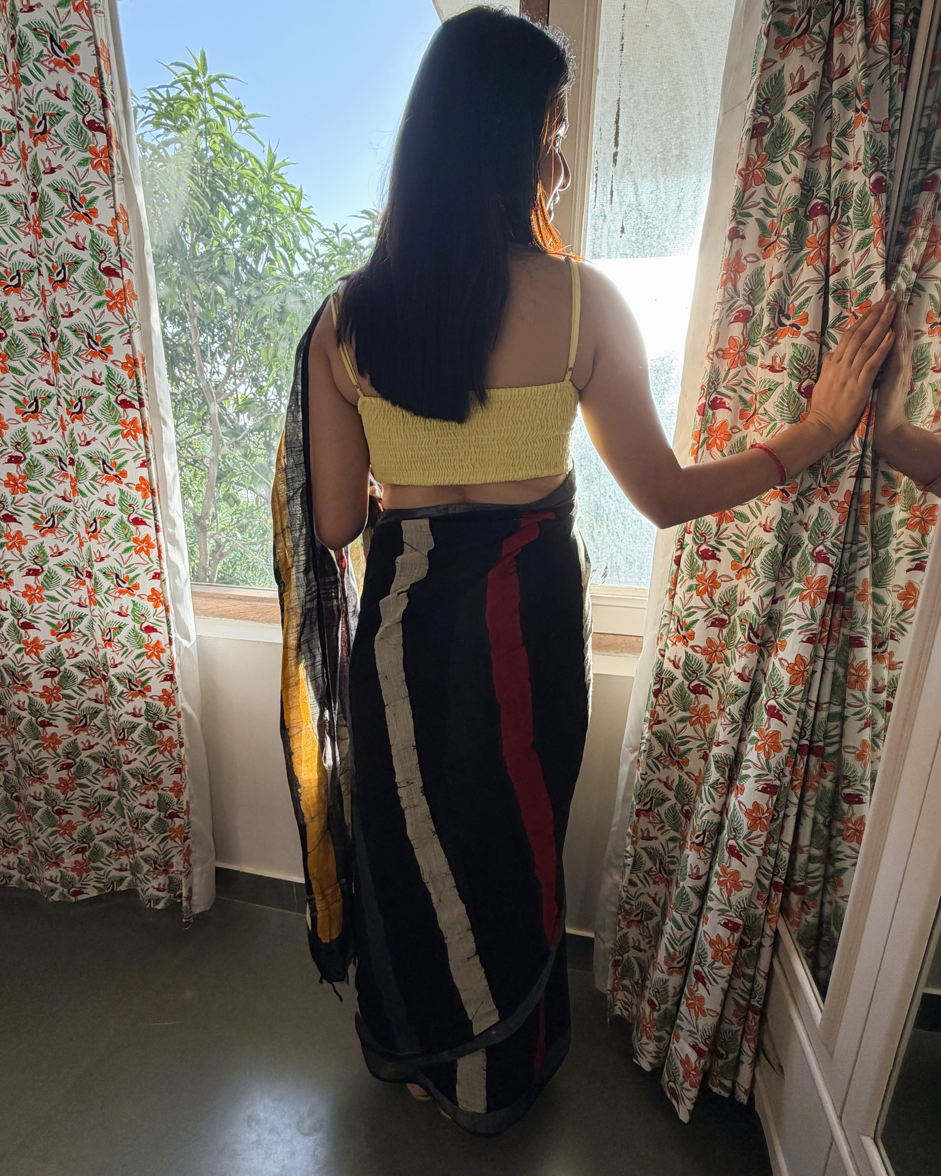 back view black batik print linen saree with pallu