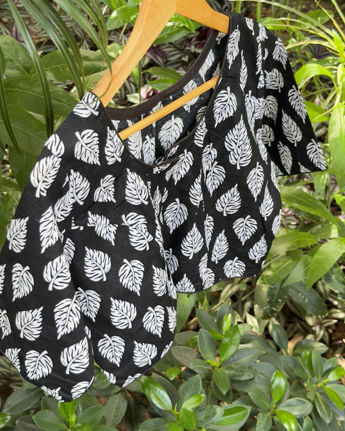 Black cotton leaf print blouse with white botanical motifs, back view
