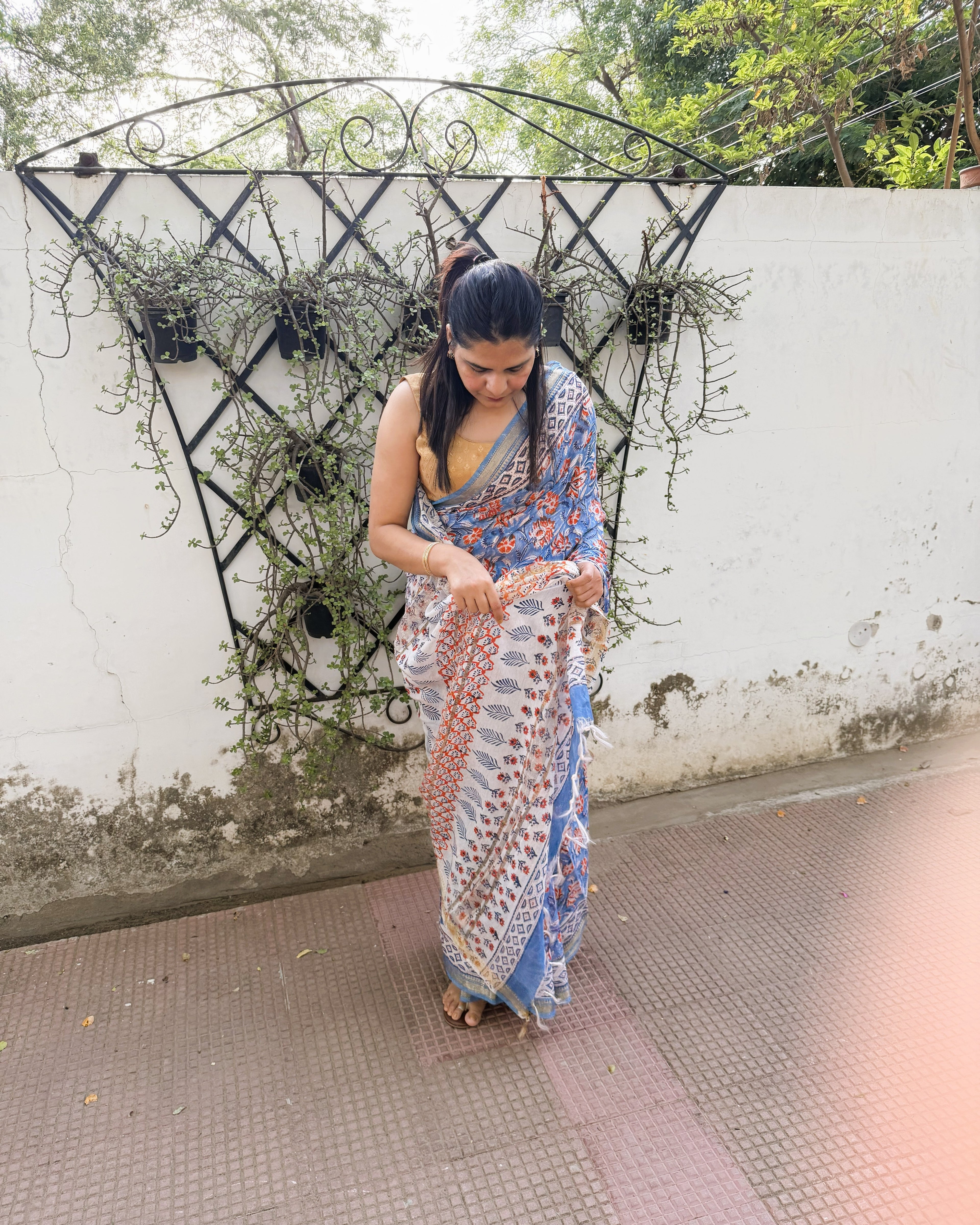 side angle blue floral saree elegant flow