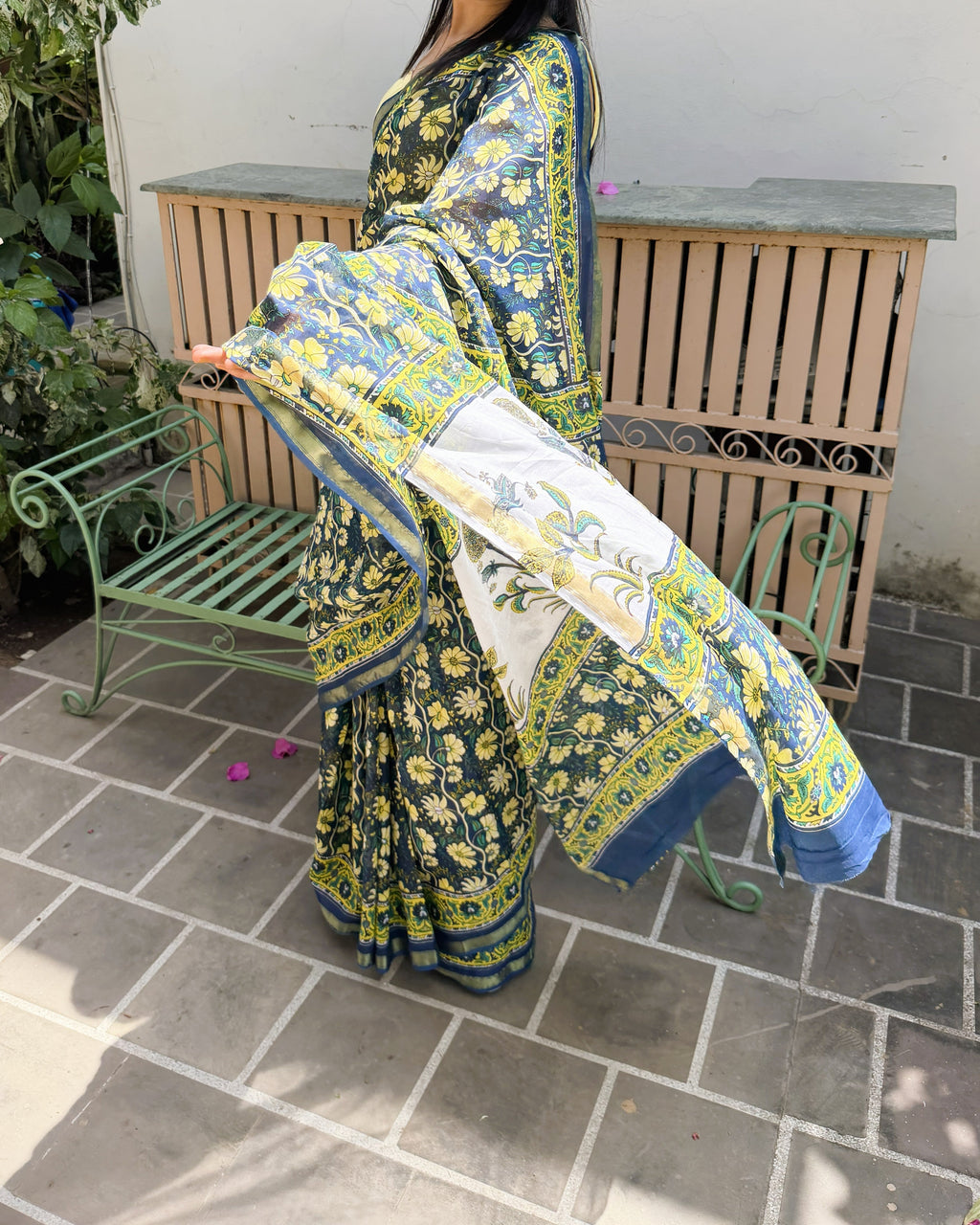 side angle blue floral print saree with zari border