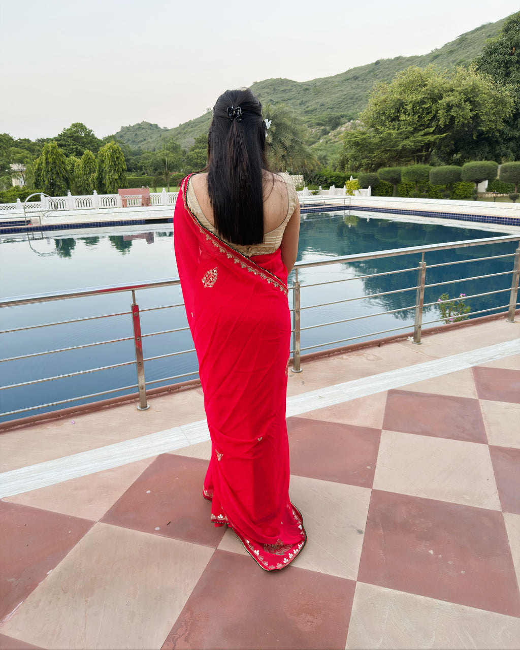 Deep red georgette saree with intricate Gotta Patti work