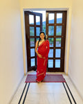 Deep red saree with gold Gotta Patti work and green detailing
