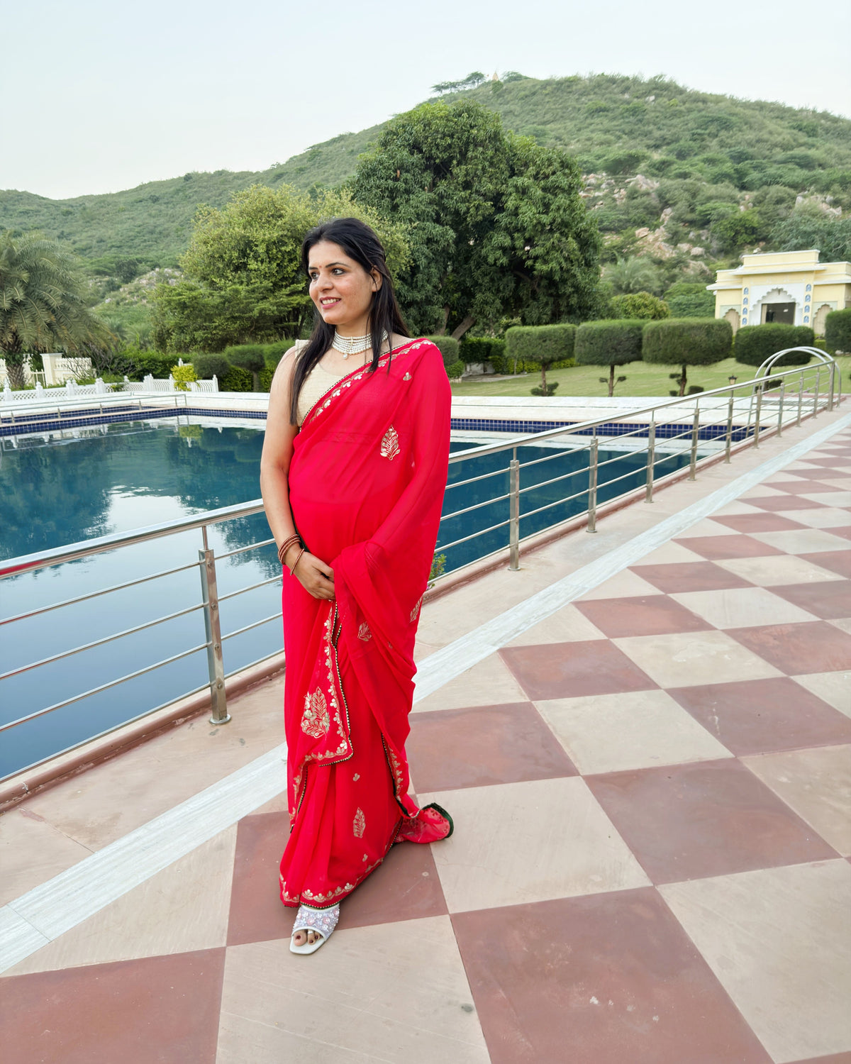 Deep red festive saree with embellished Gotta Patti border