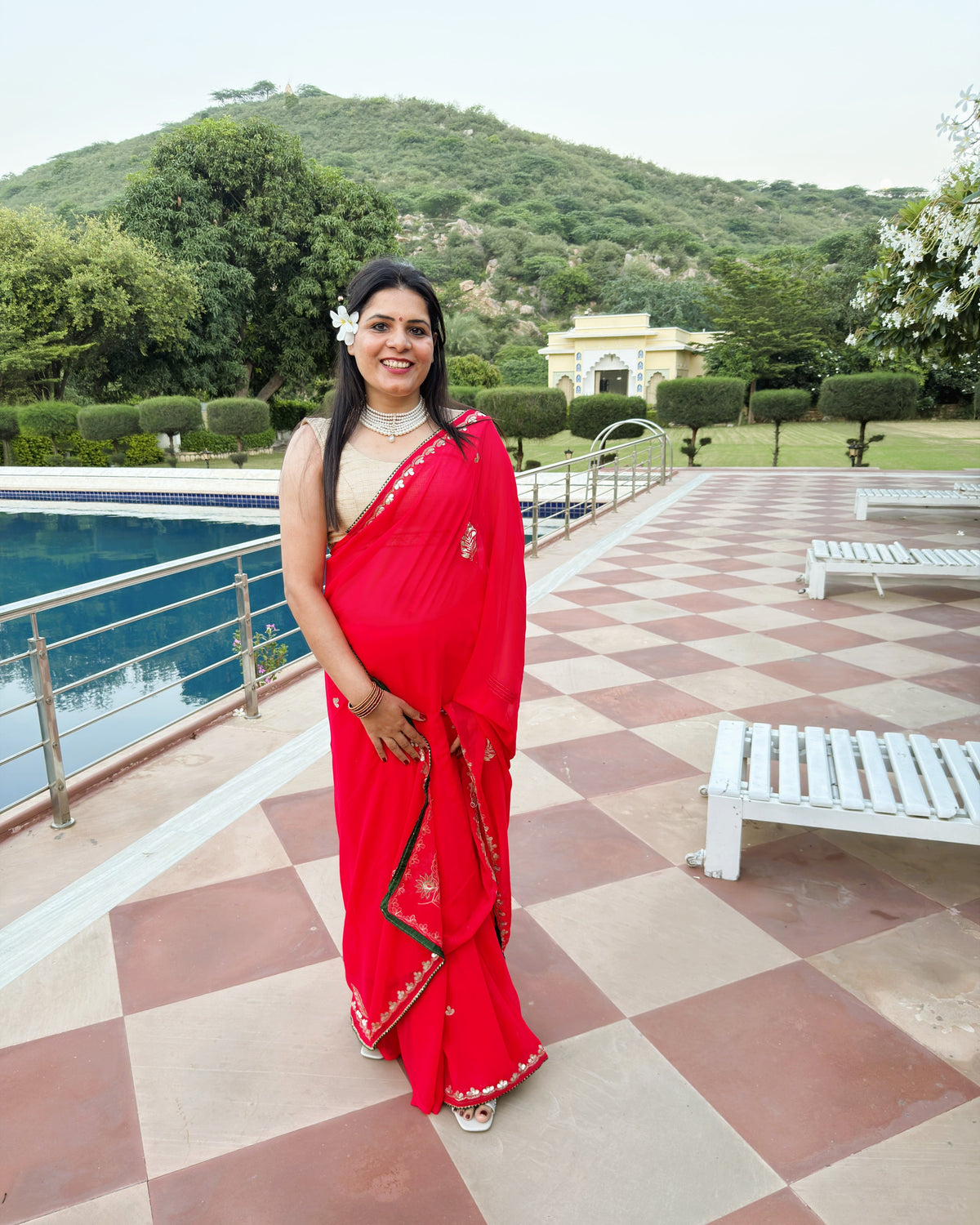 Deep red festive saree with embellished Gotta Patti border