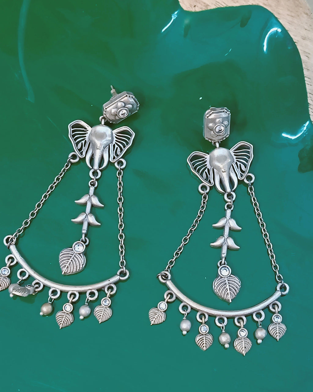 Ganesha Bloom necklace set styled with ethnic wear, showcasing the oxidised silver finish and multi-strand bead chain