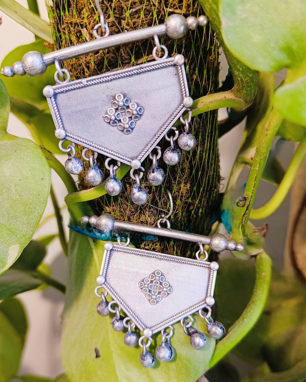 Close-up of the row of dangling ghungroo ball drops along the base of the Khanjar antique oxidised silver shield earring