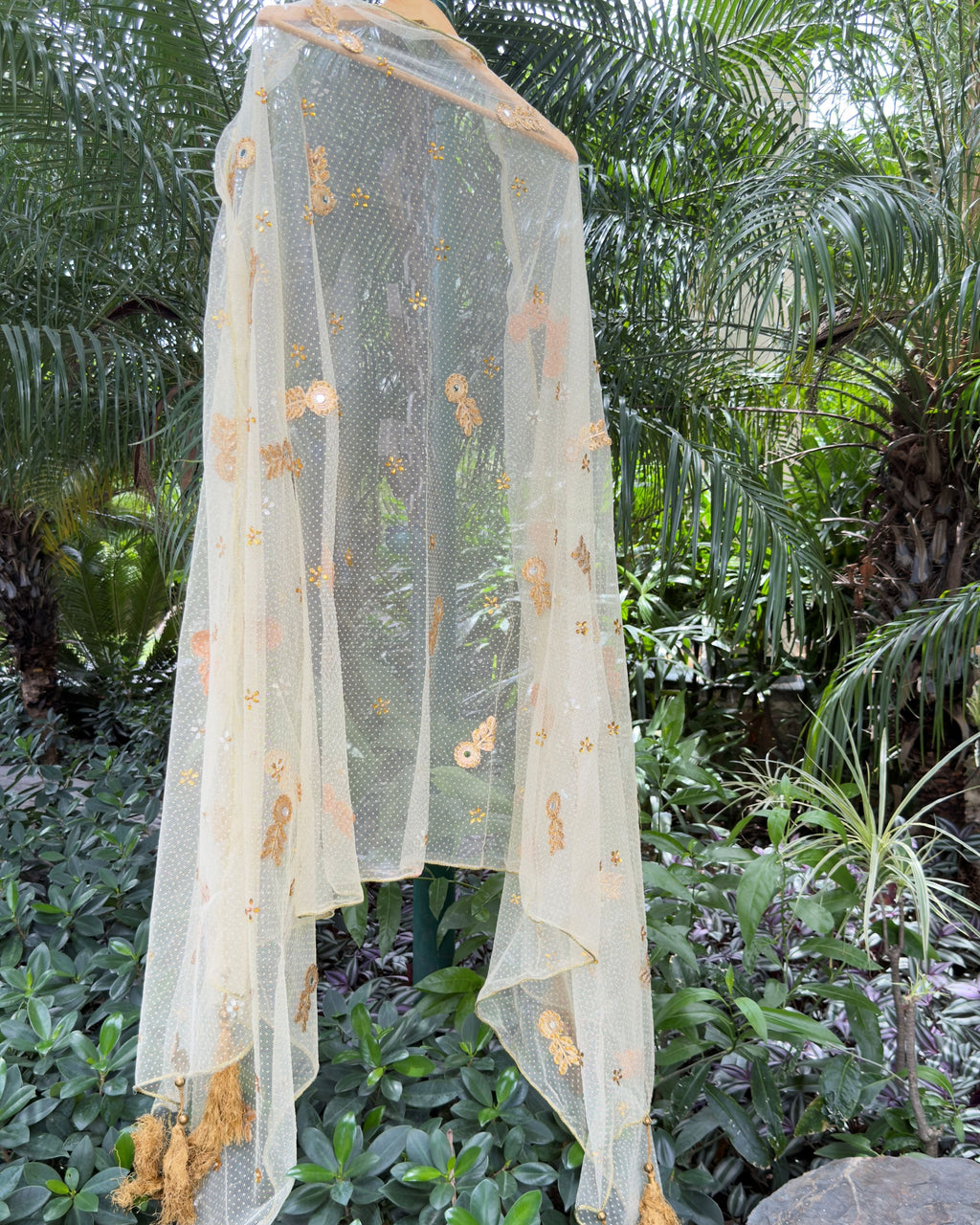 Golden handcrafted net dupatta with embellished floral motifs