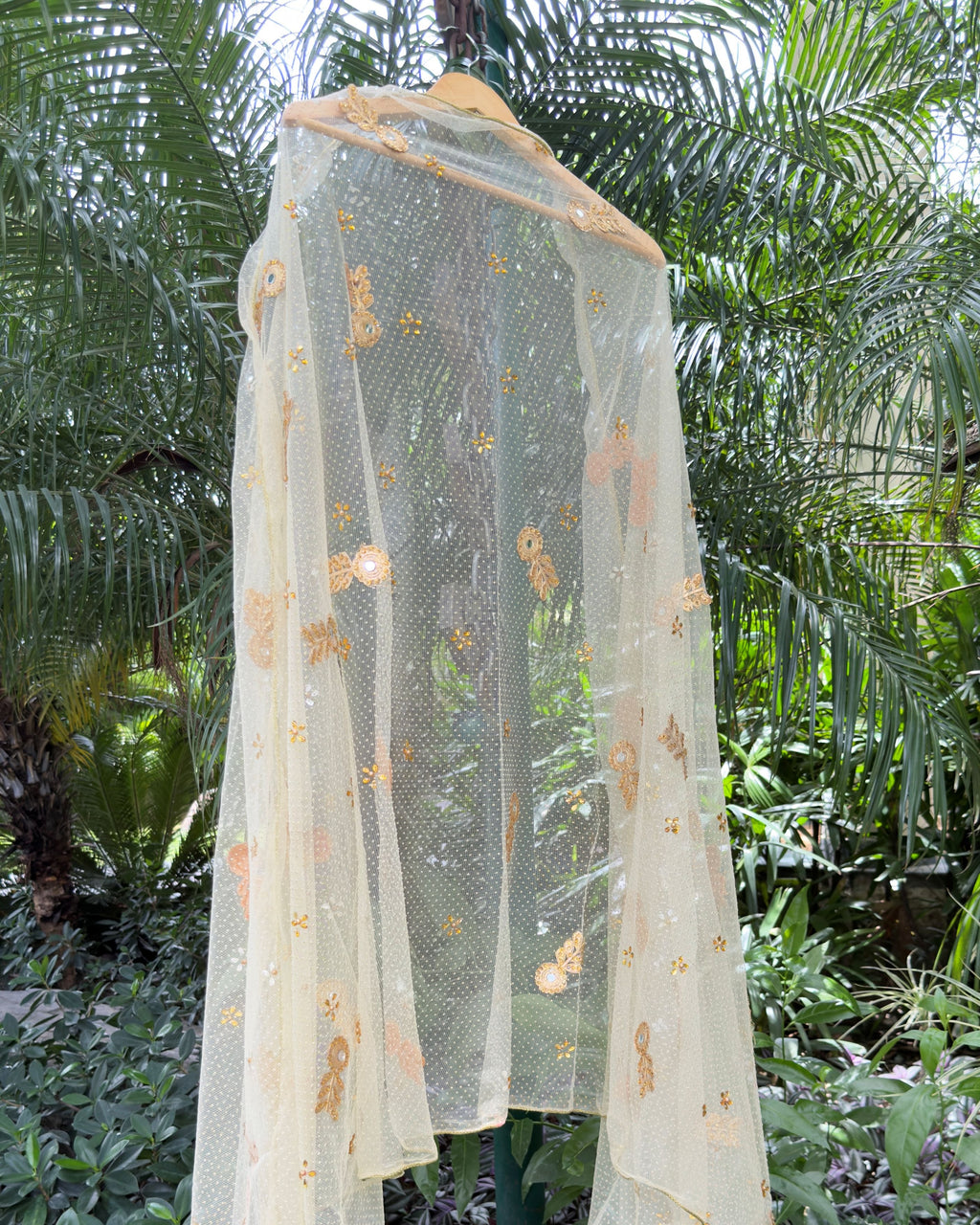 Golden net dupatta with decorative tassel border and gold detailing
