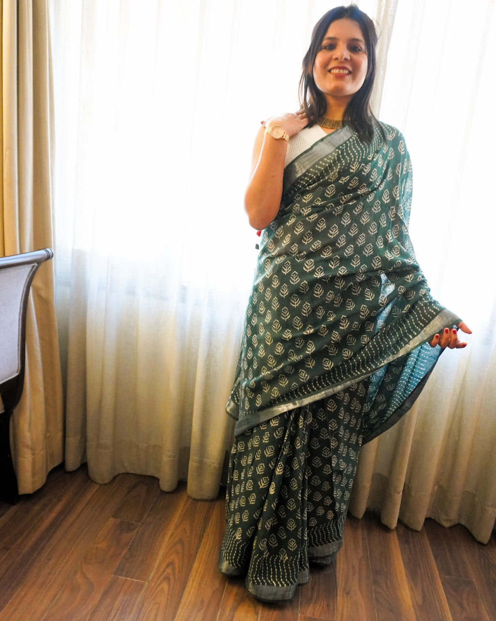 Front view of green and beige hand block leaf print linen saree