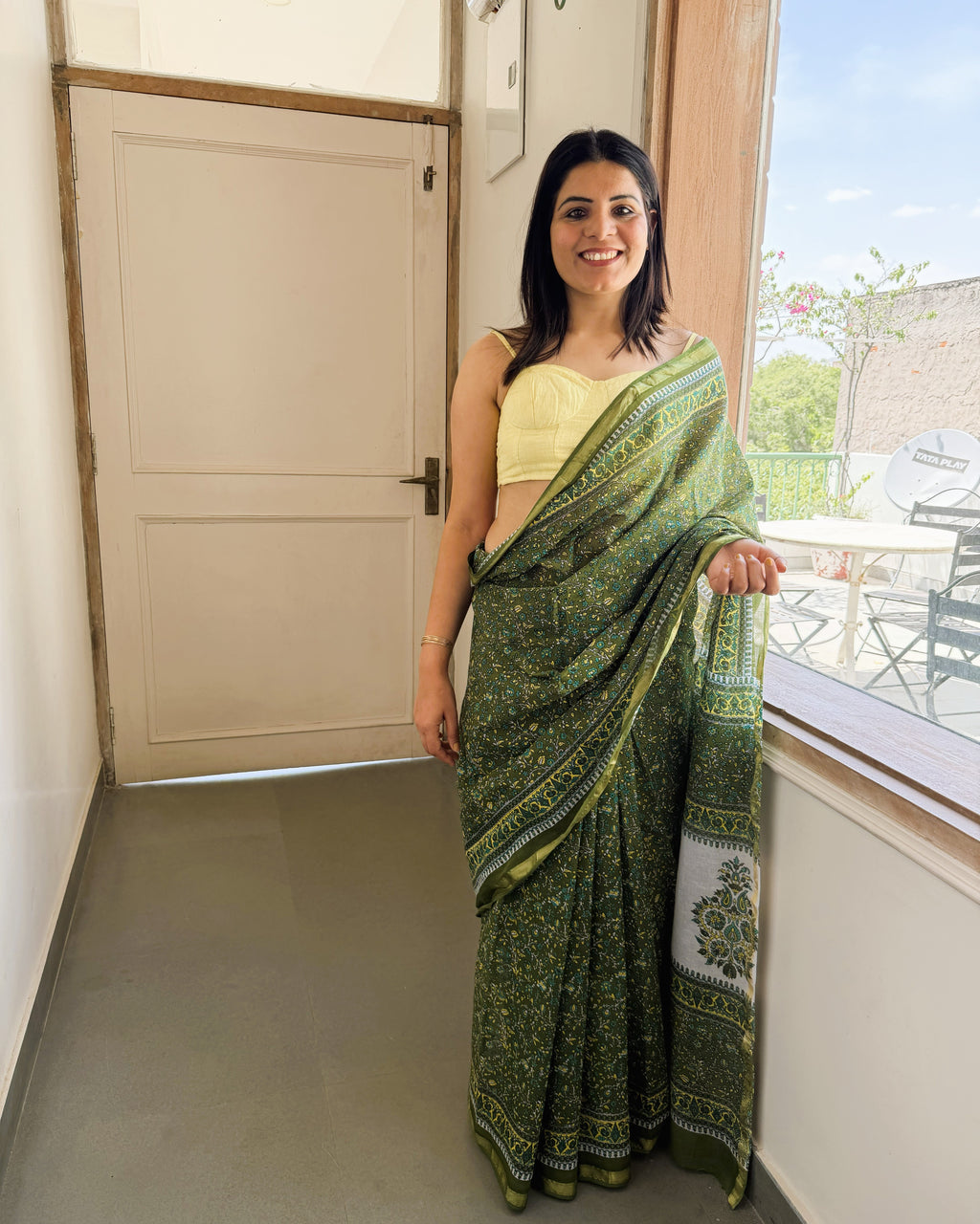 green sanganeri print saree front view with zari border