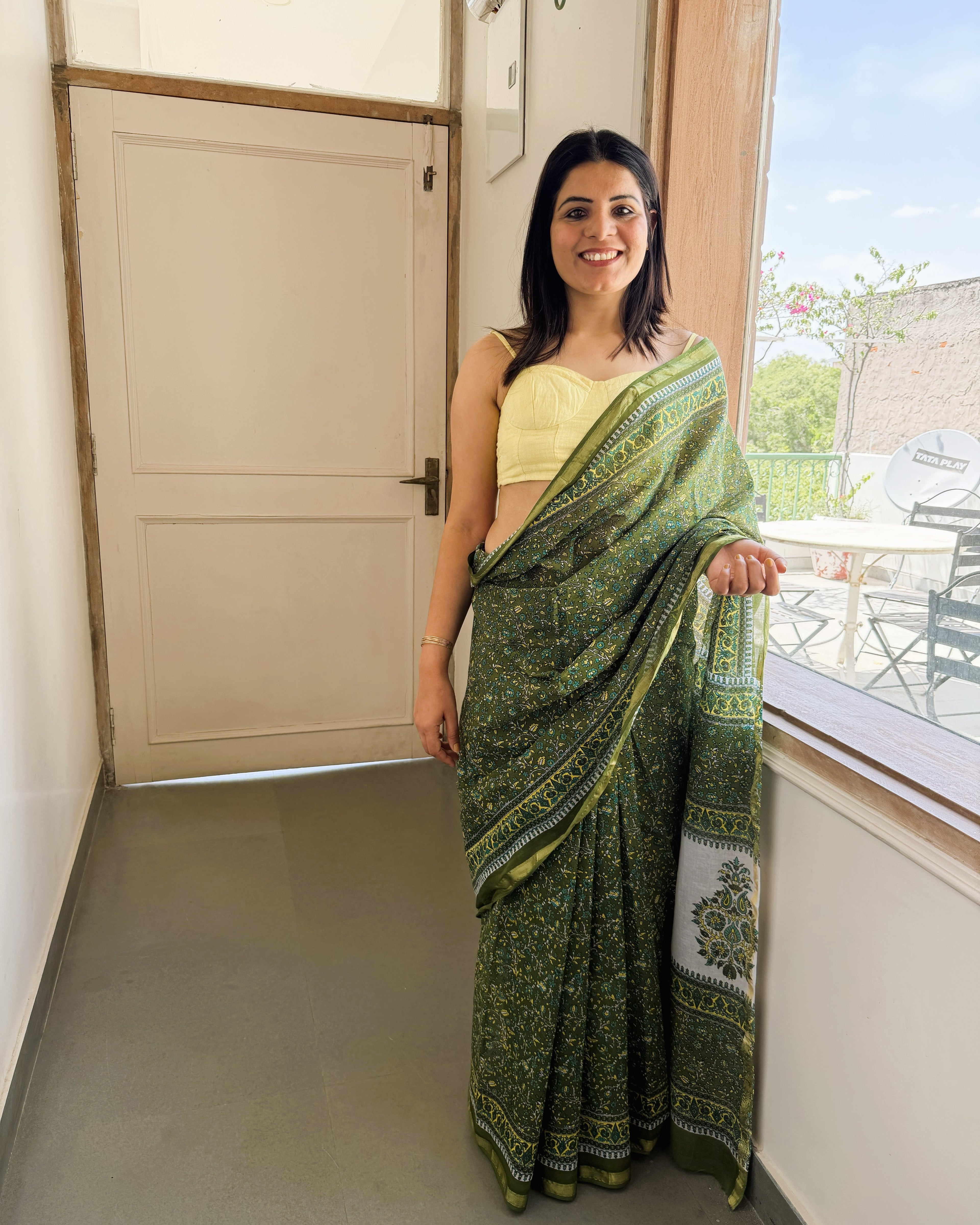 green sanganeri print saree front view with zari border