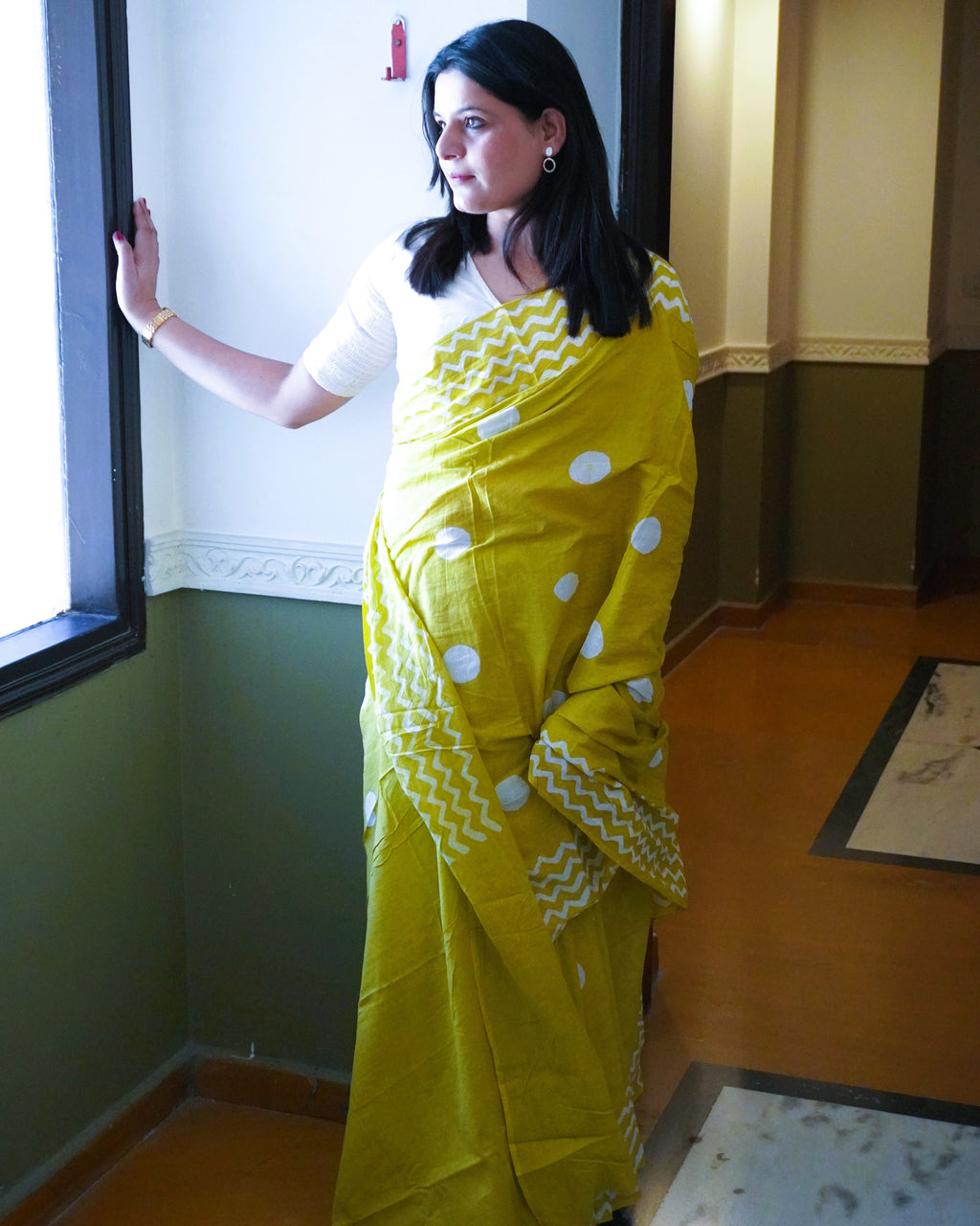 Green cotton saree with white polka dots front view