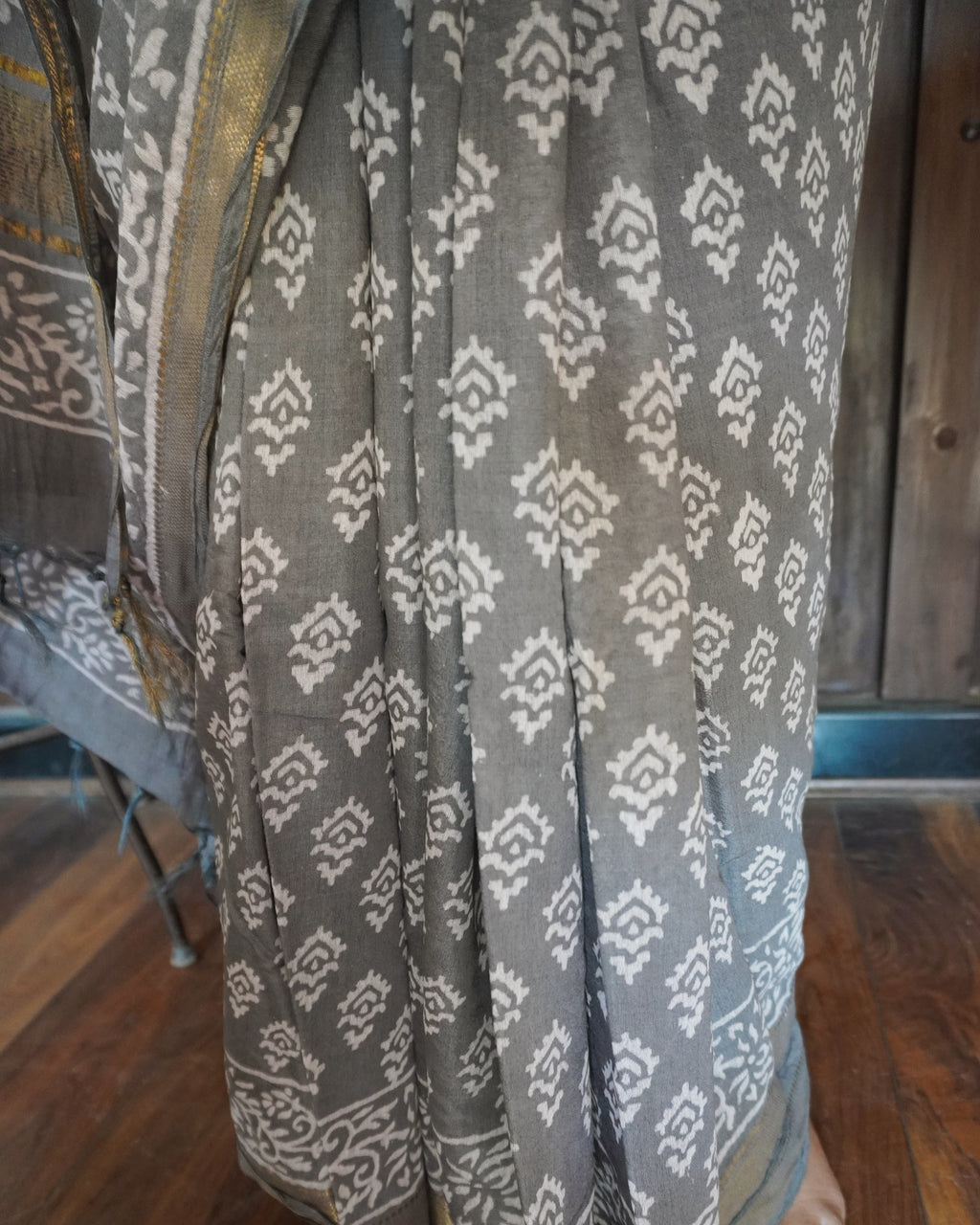Close up of handblock print on grey pure linen saree
