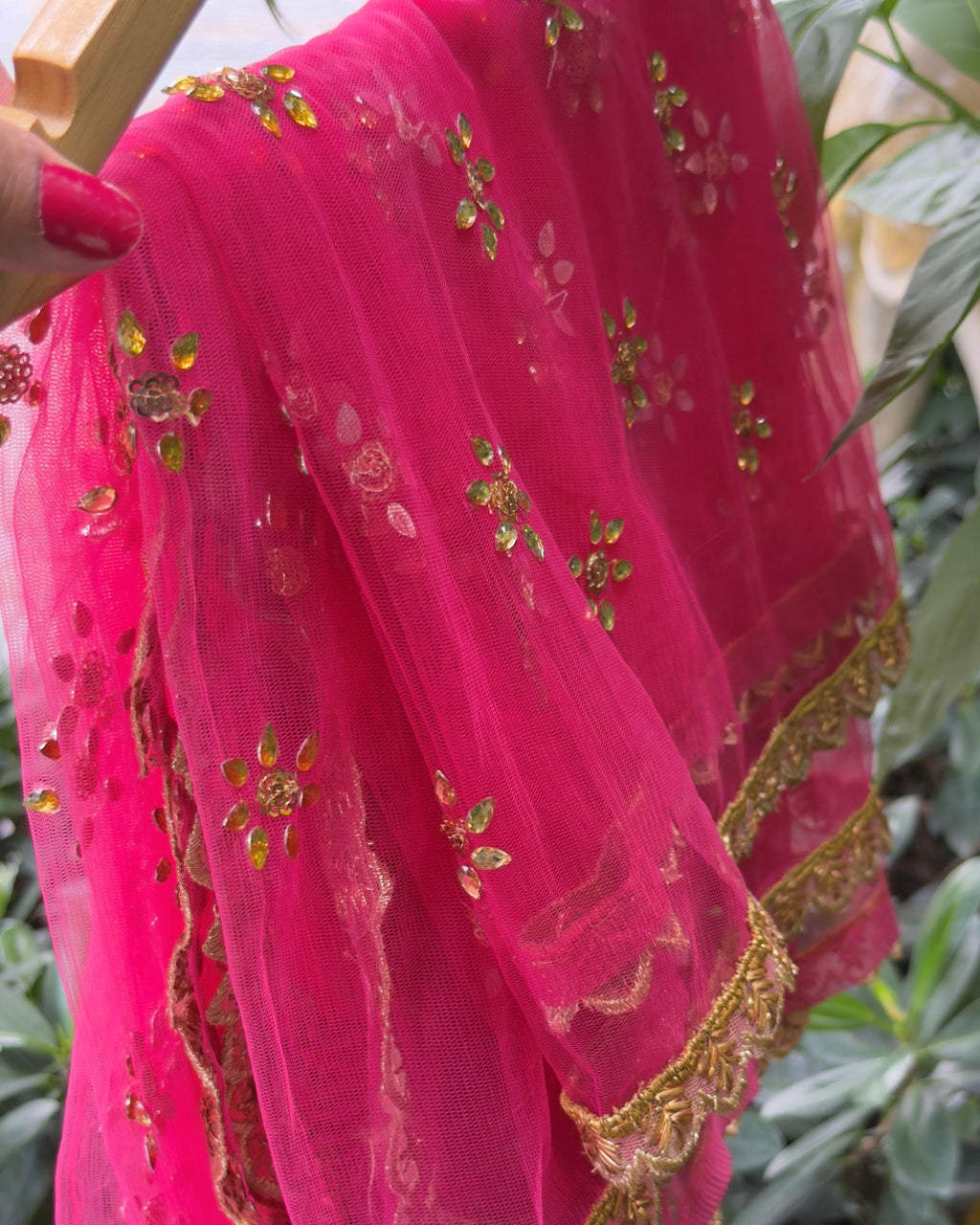 Handcrafted pink net dupatta with golden embroidery and border detail