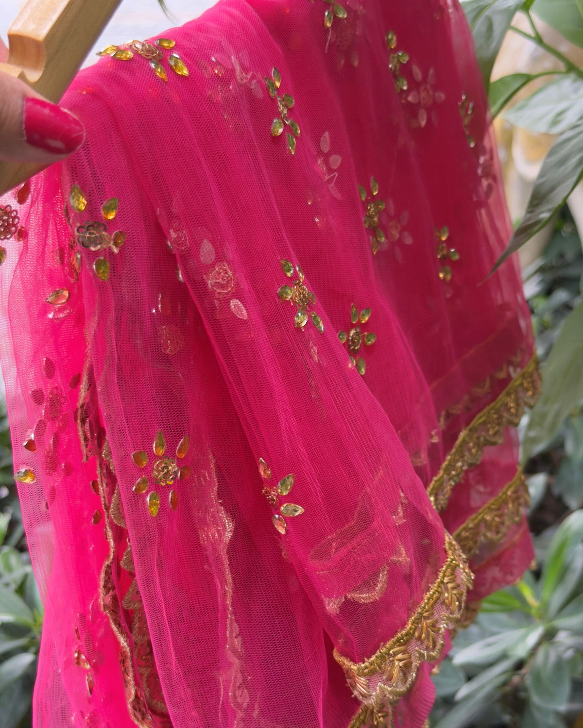 Handcrafted pink net dupatta with golden embroidery and border detail