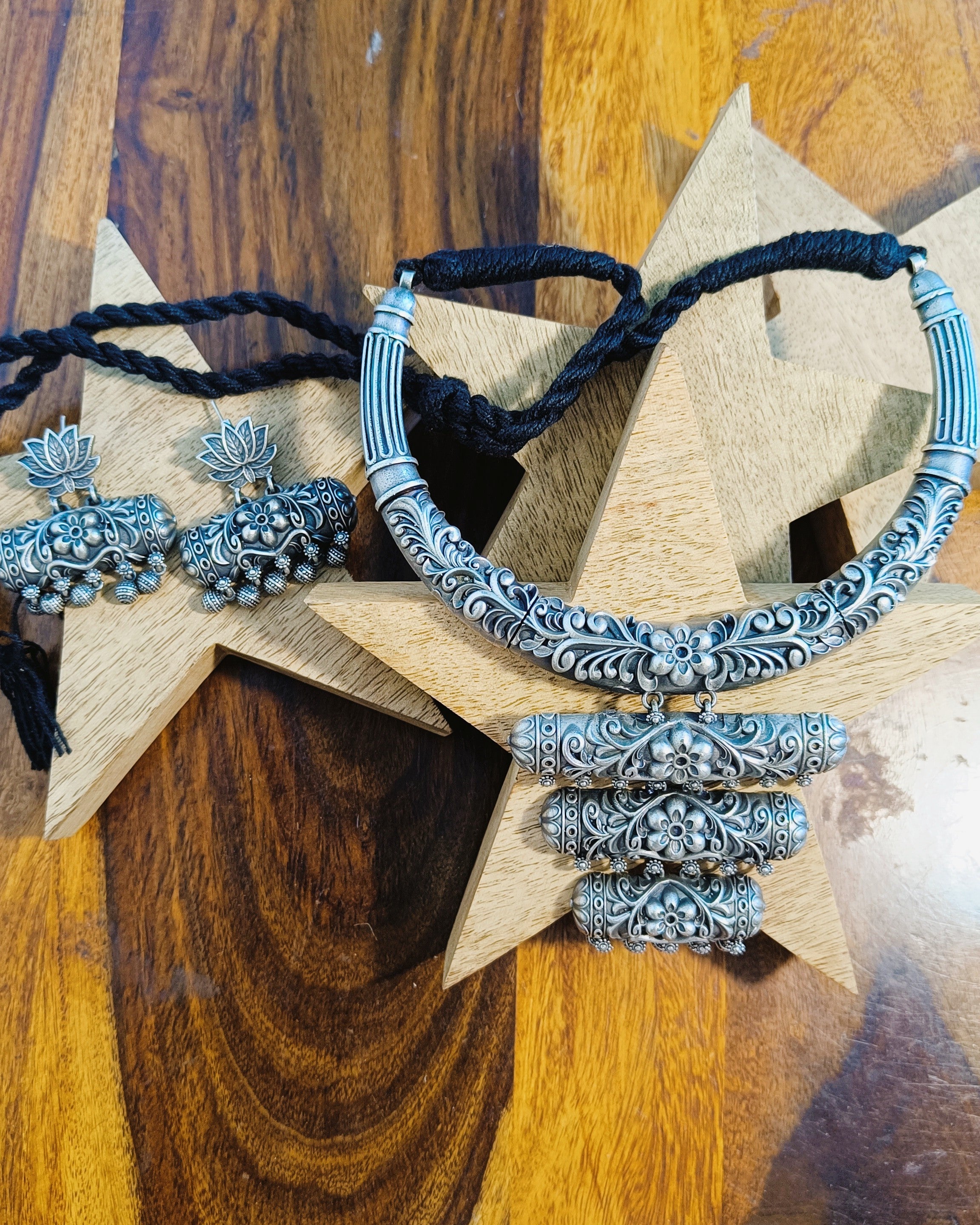 Kamal Vritti oxidised silver choker necklace and elephant earrings set styled with ethnic wear showcasing the antique finish and carved pendant