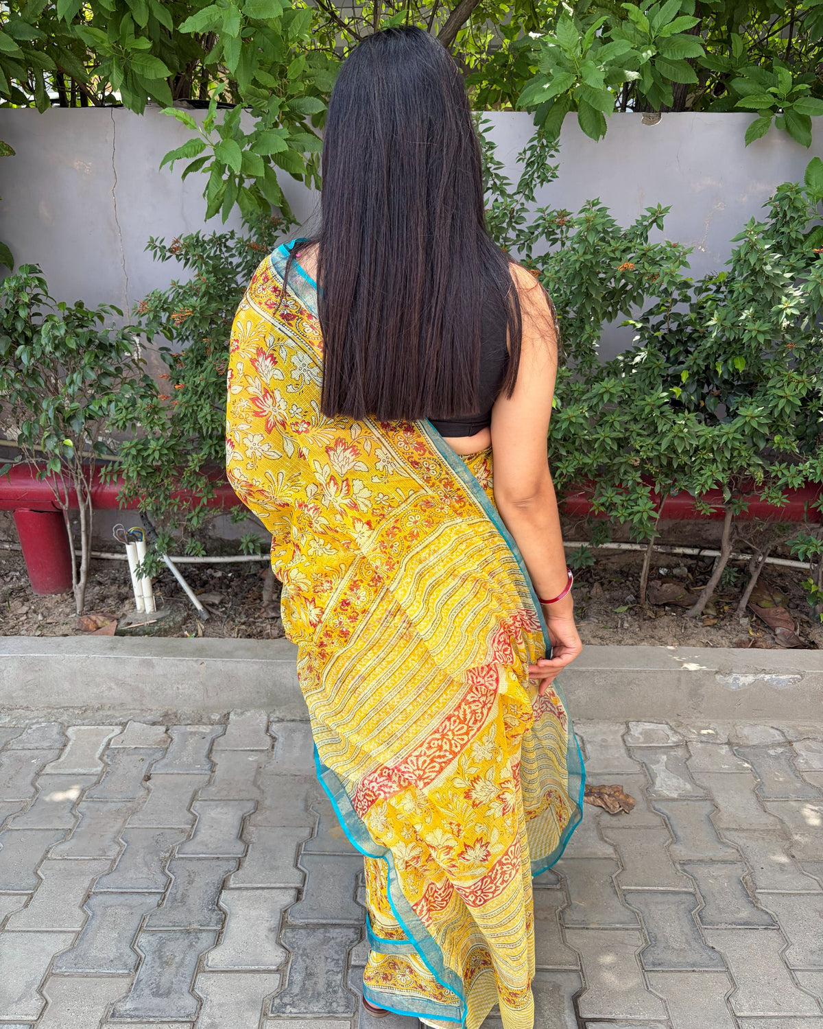 Mustard yellow Kota Doria saree with contrasting teal border