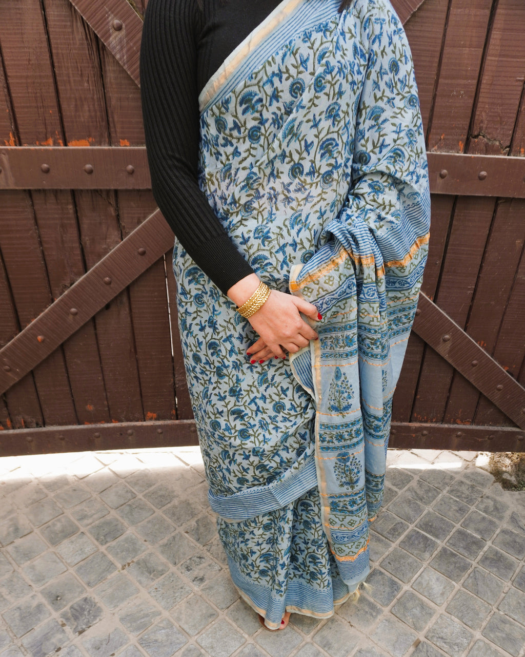 Detailed view of light blue Sanganeri print on zari cotton Chanderi saree
