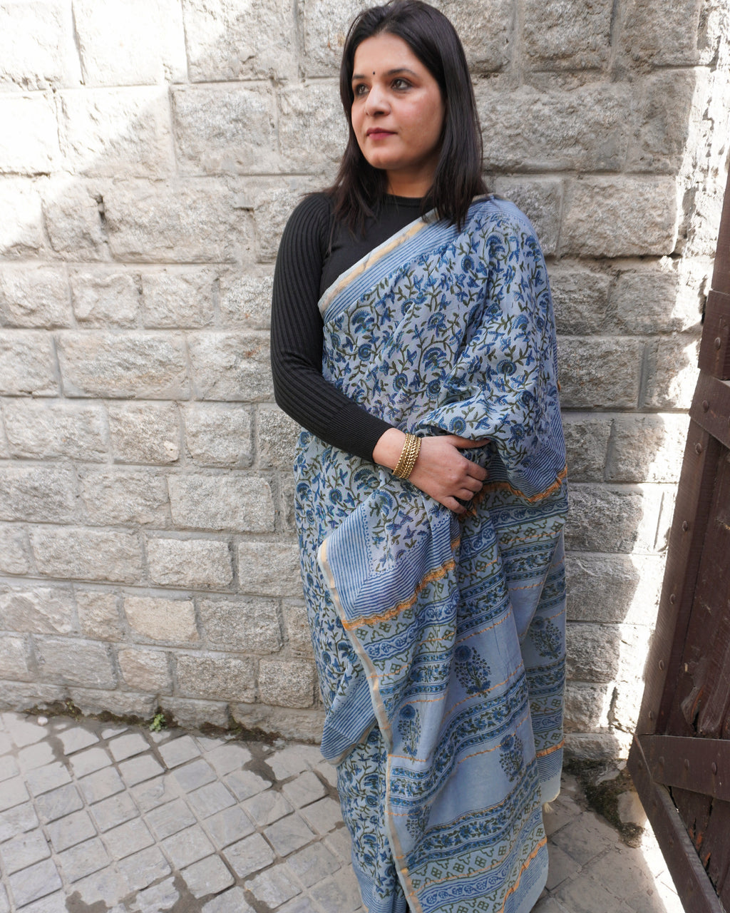 Side view of light blue Sanganeri printed Chanderi saree with zari