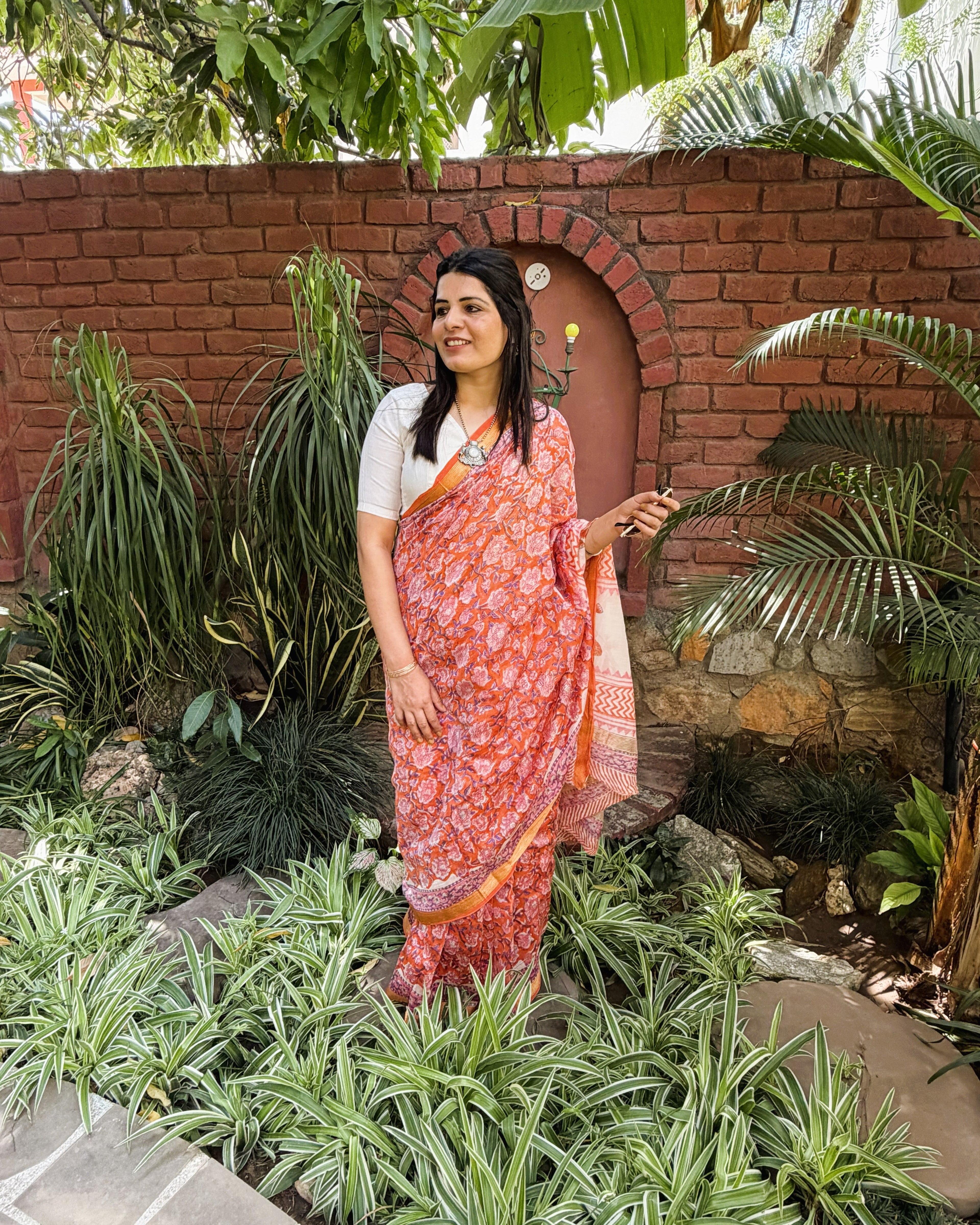 side view light orange maheshwari silk saree sanganeri print drape