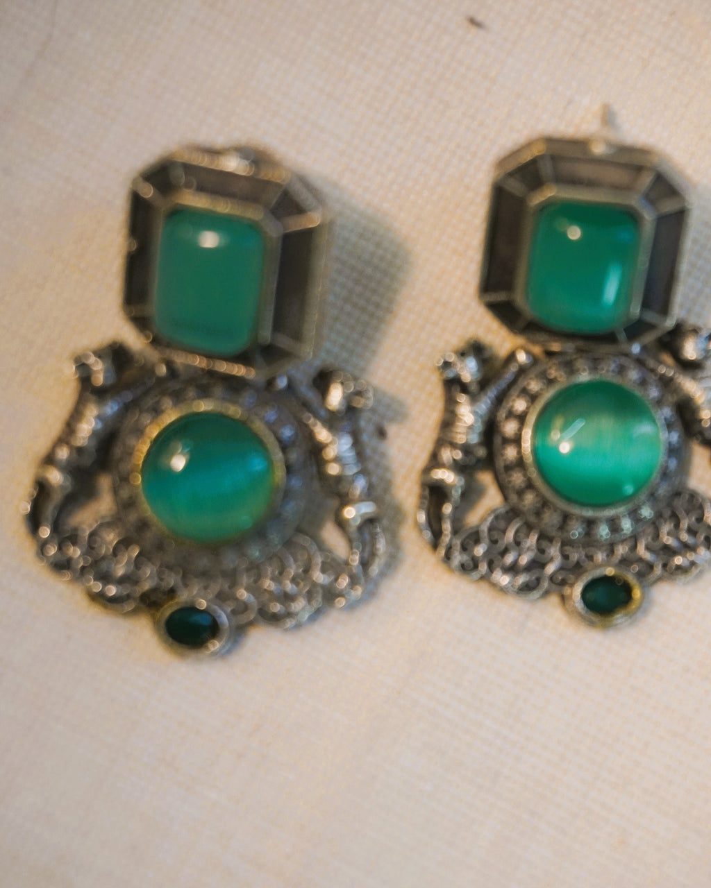 Antique oxidised silver lion motif stud earrings with square emerald-green stone and round green onyx cabochon accent