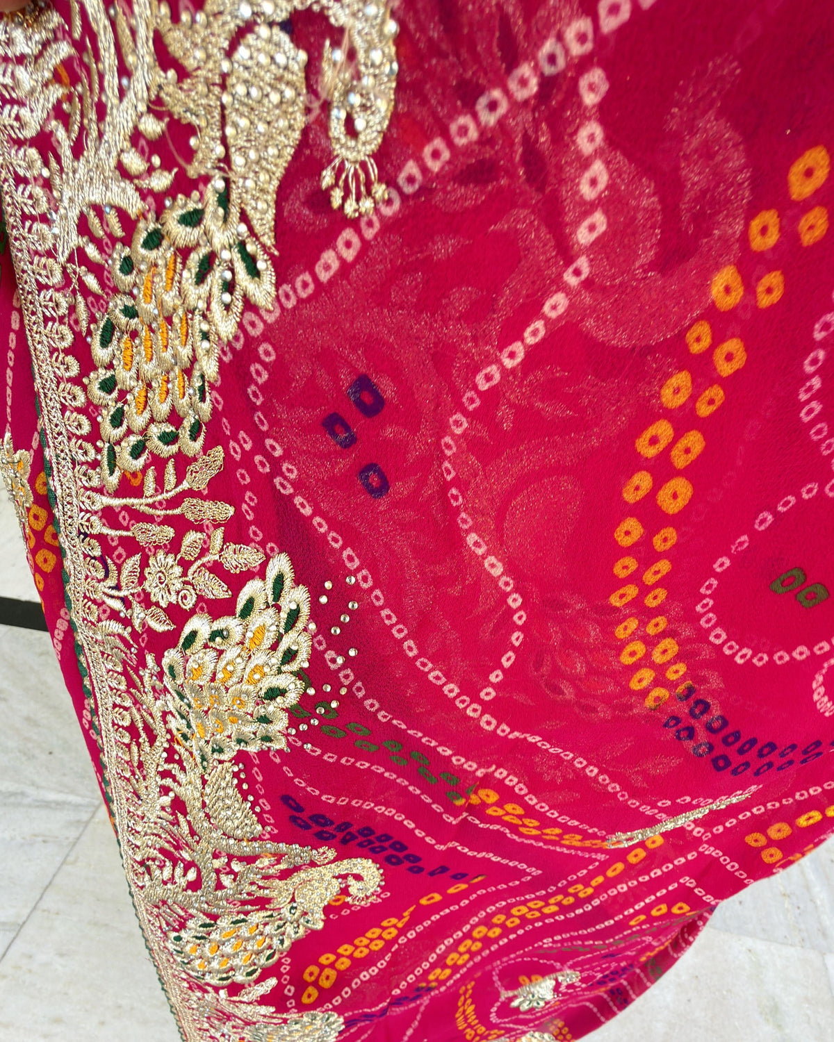 Colourful magenta georgette saree with traditional Zari embellishment