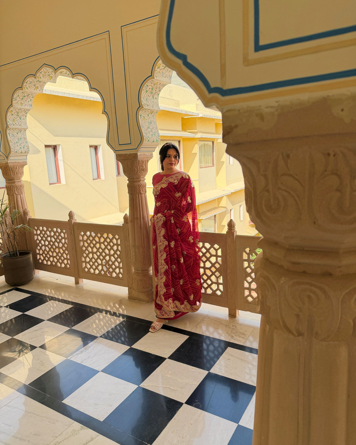 Magenta georgette saree with floral Zari work motifs