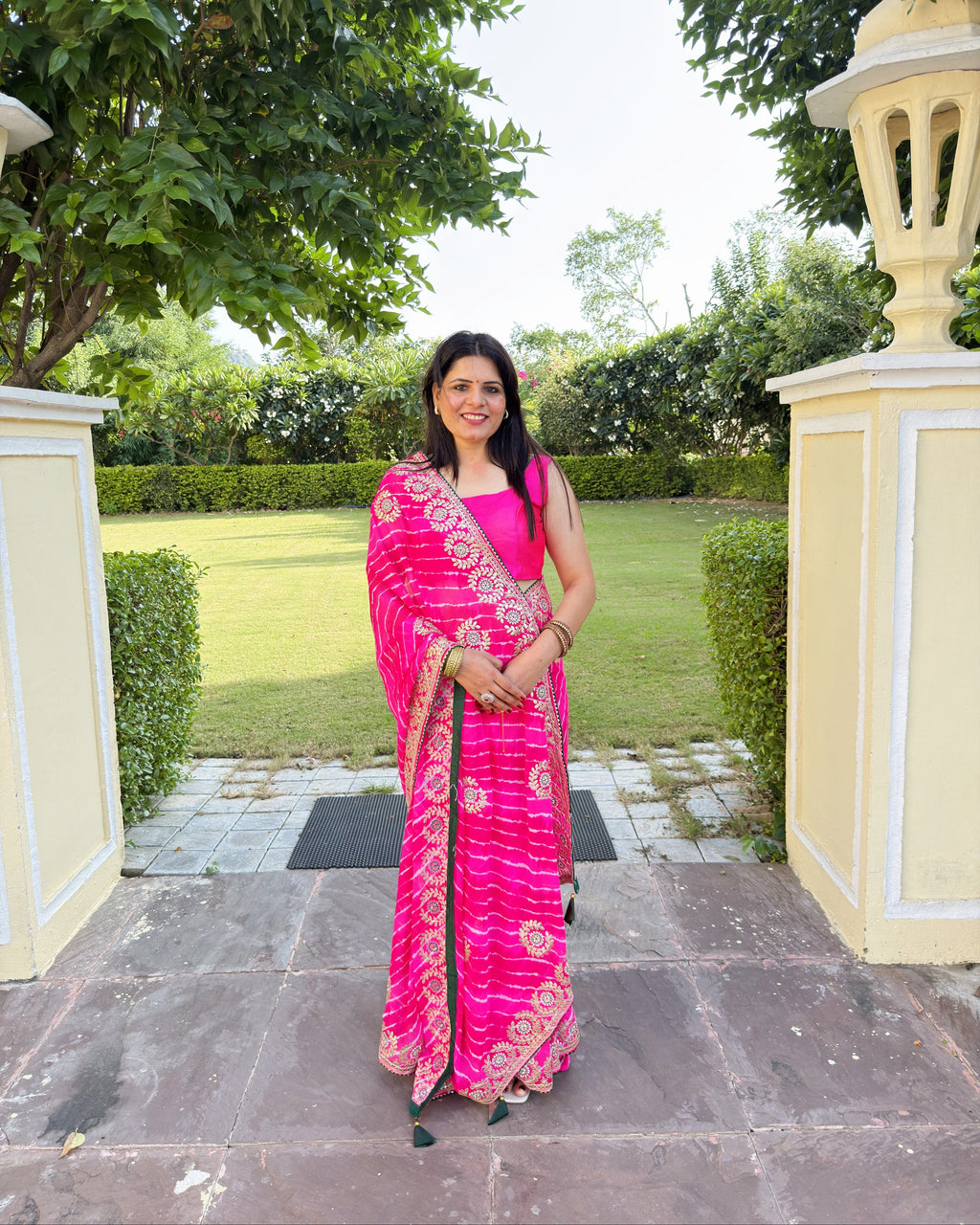 Magenta georgette saree with traditional Gotta Patti embroidered motifs