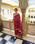 Magenta georgette Zari work saree with colourful Bandhani-inspired pattern and embellished border