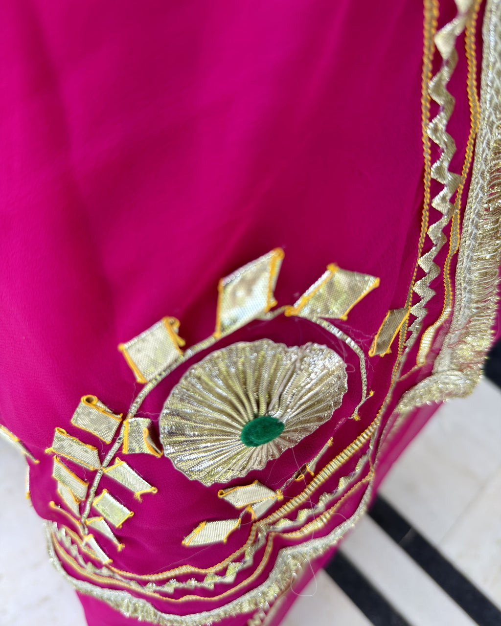 Close-up of intricate Gotta work on magenta saree
