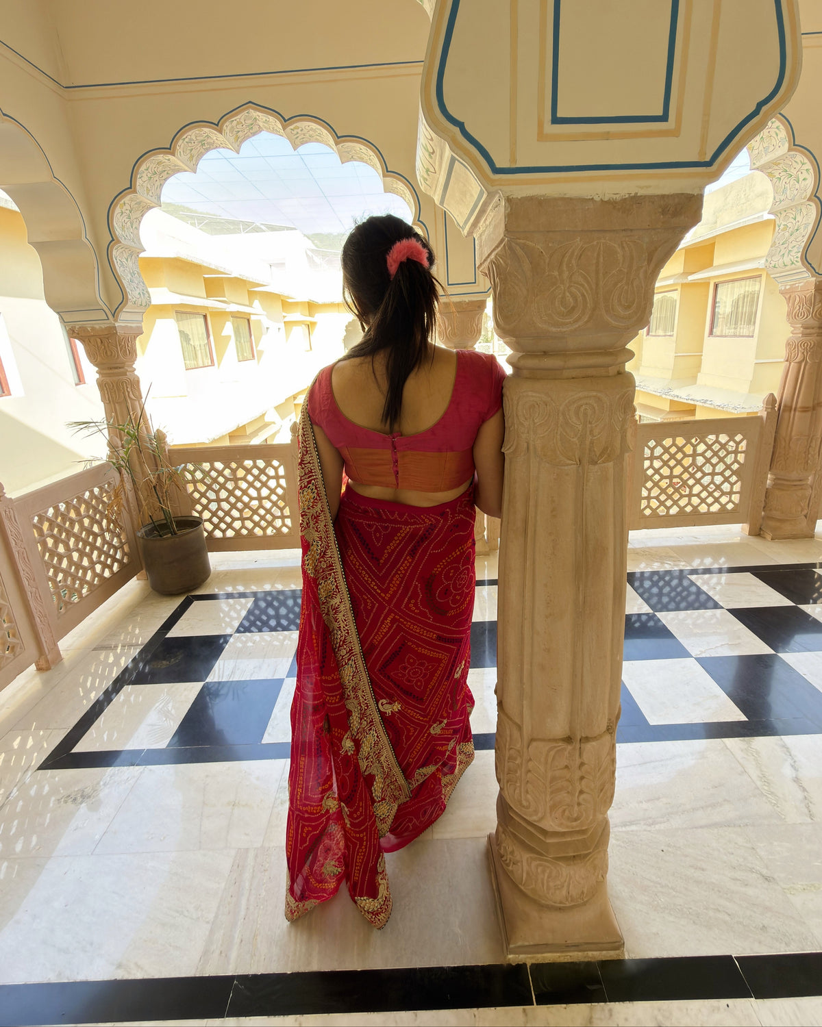 Traditional magenta georgette saree with intricate Zari border
