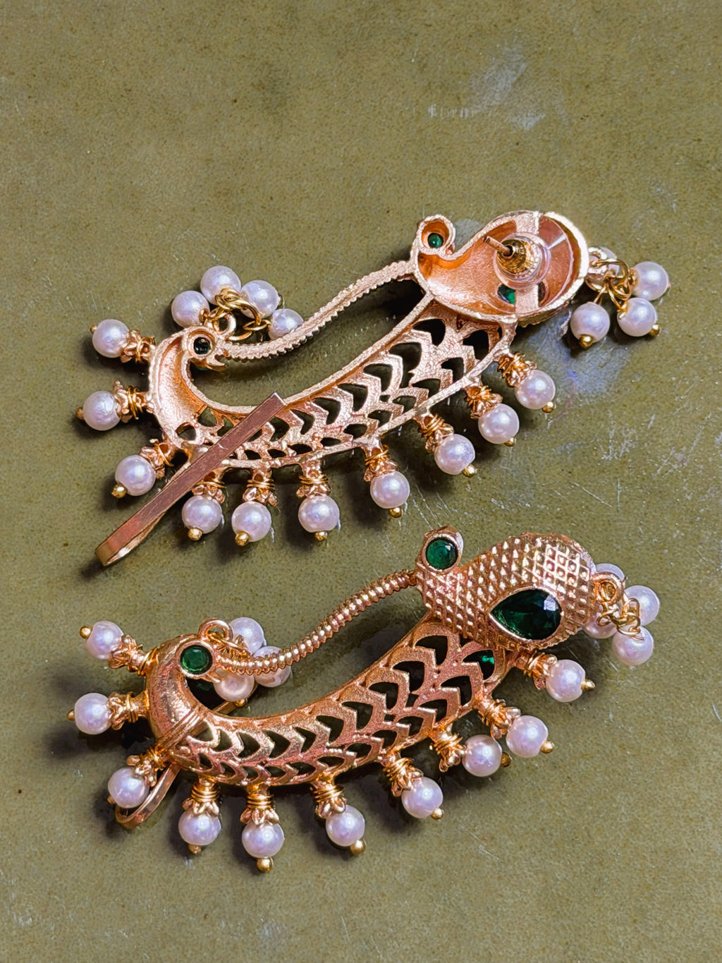 Heritage inspired earrings with intricate craftsmanship and gemstone detailing